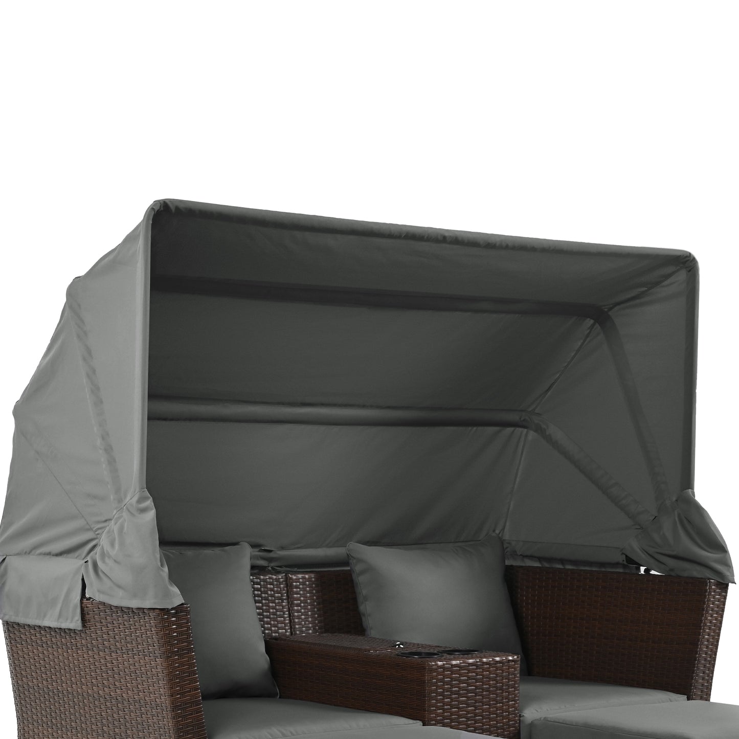Gray canopy over brown wicker outdoor sofa with dark gray cushions