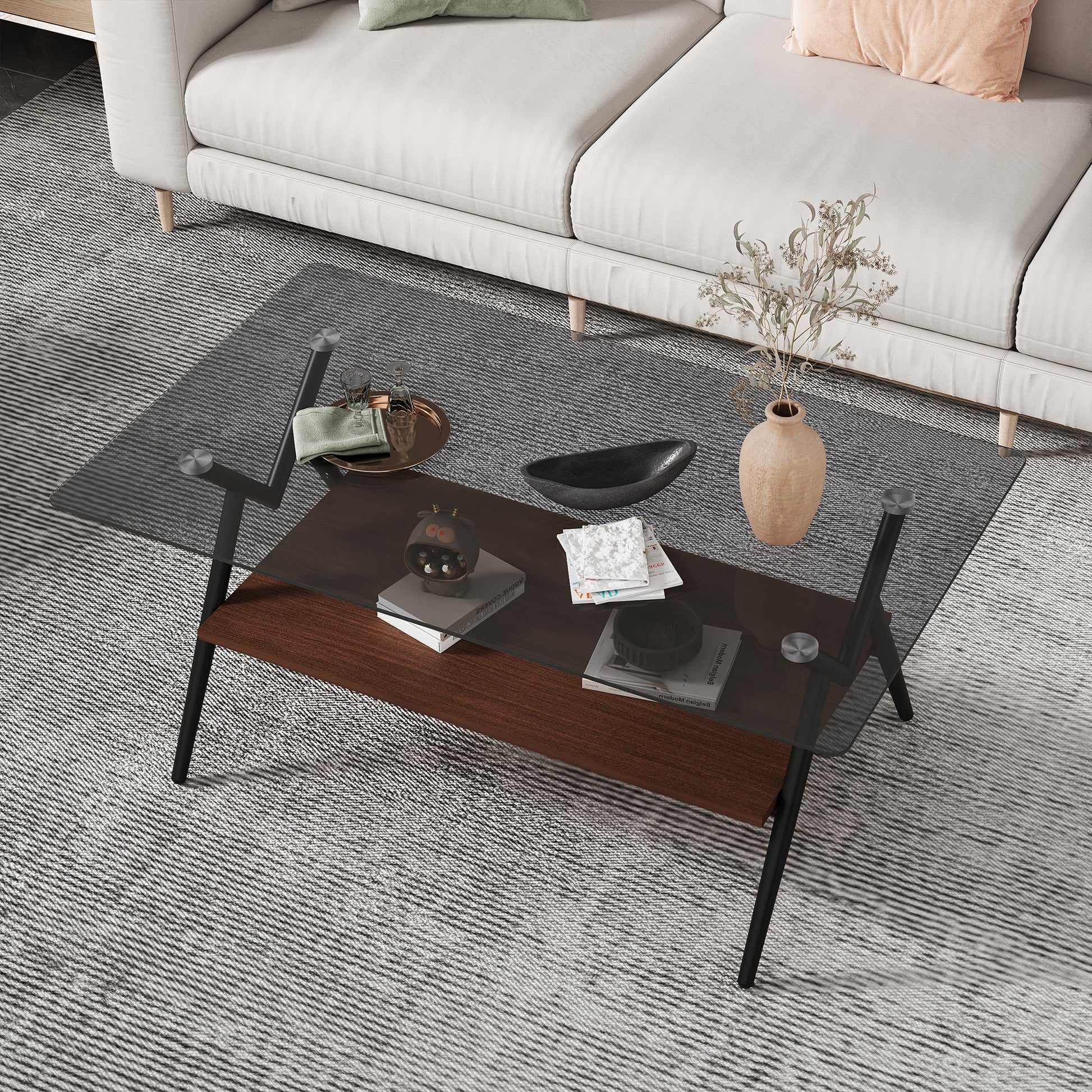 Modern glass top coffee table with dark wood shelf and black metal legs