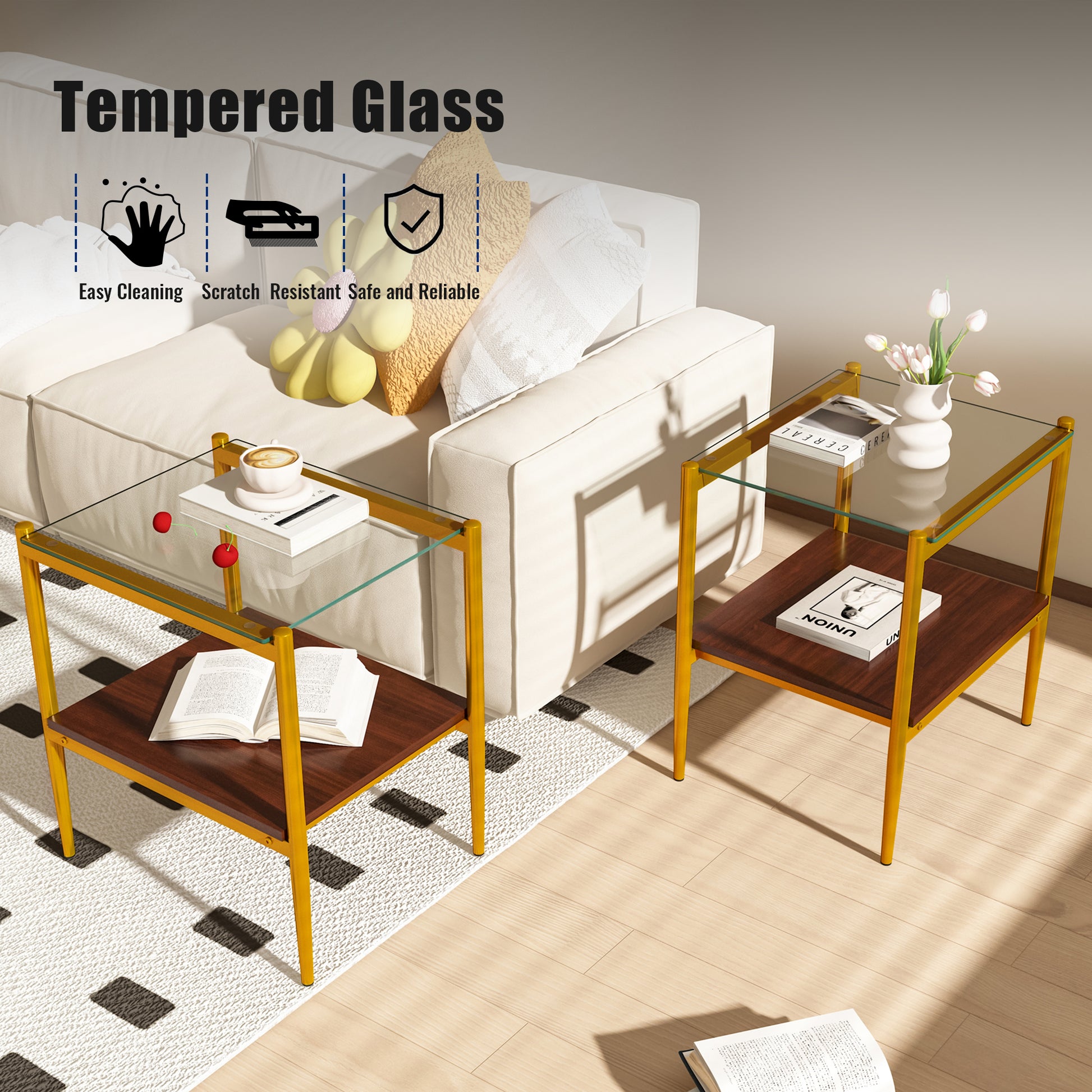 Goldframed tempered glass end table with dark wood shelf displaying a coffee cup and book