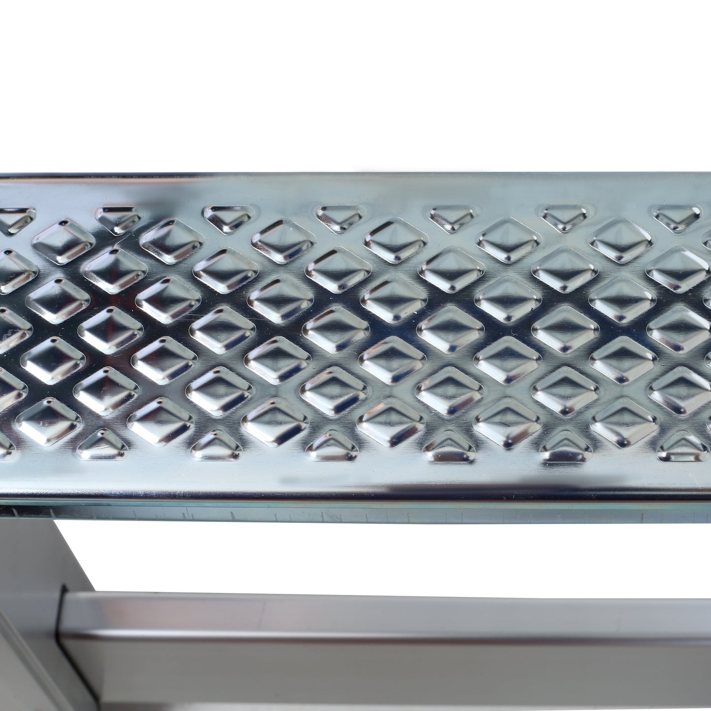 Silver metal step tread with diamond pattern for grip and safety