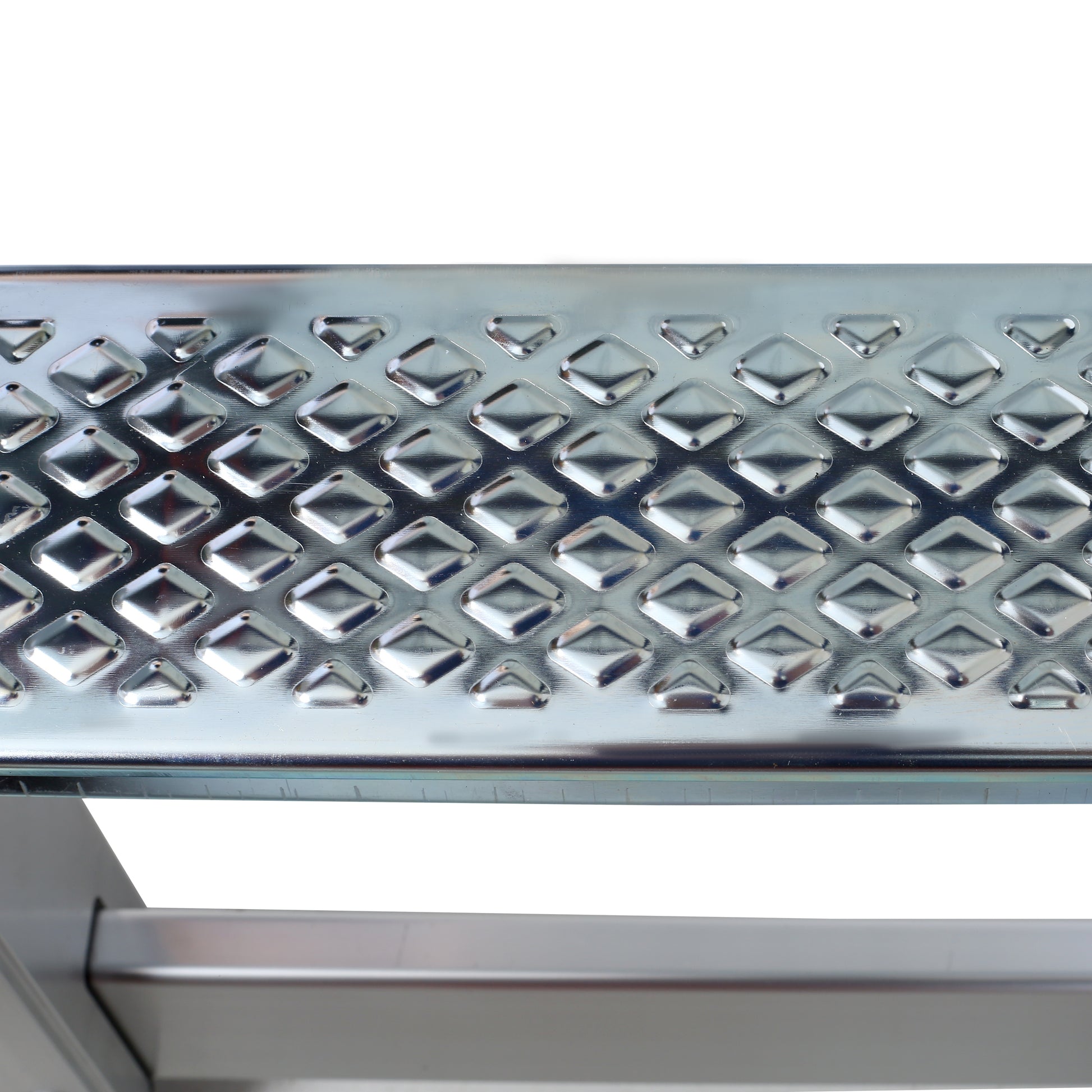Silver metal step tread with diamond pattern for grip and safety