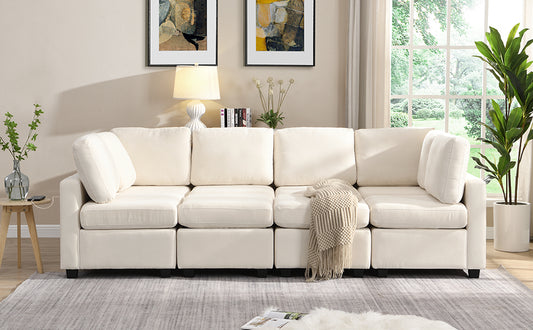 Cream fabric sectional sofa with plush cushions and a decorative throw