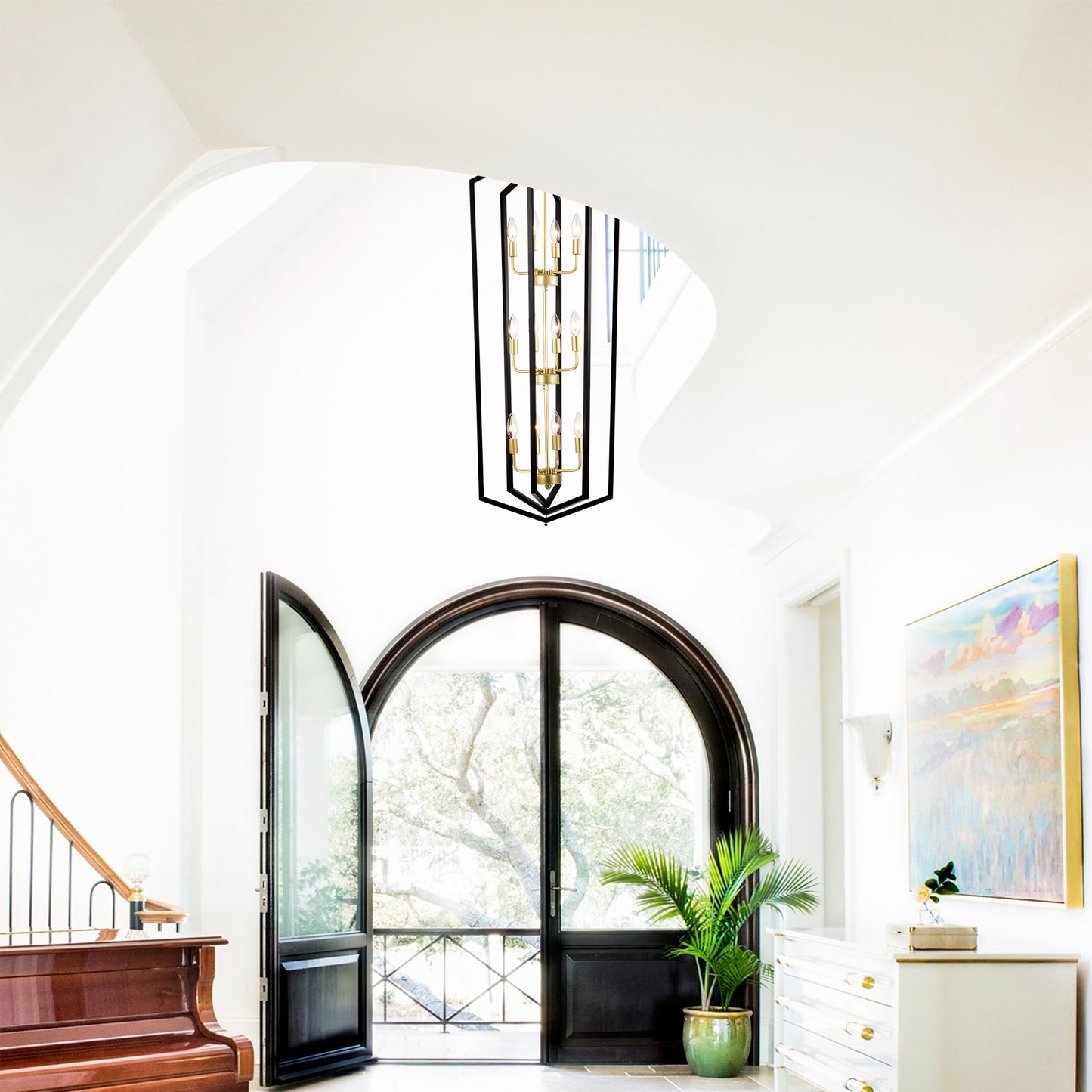 Elegant brass chandelier with multiple tiers and exposed bulbs hangs from a high ceiling