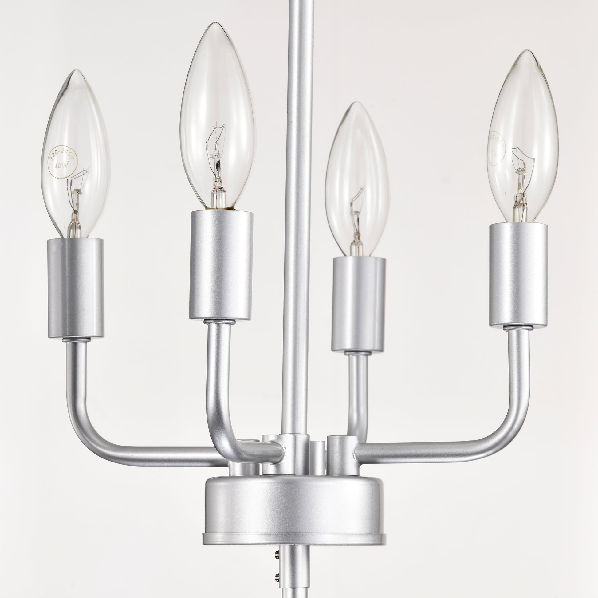 Silver metal chandelier with four clear candleshaped bulbs