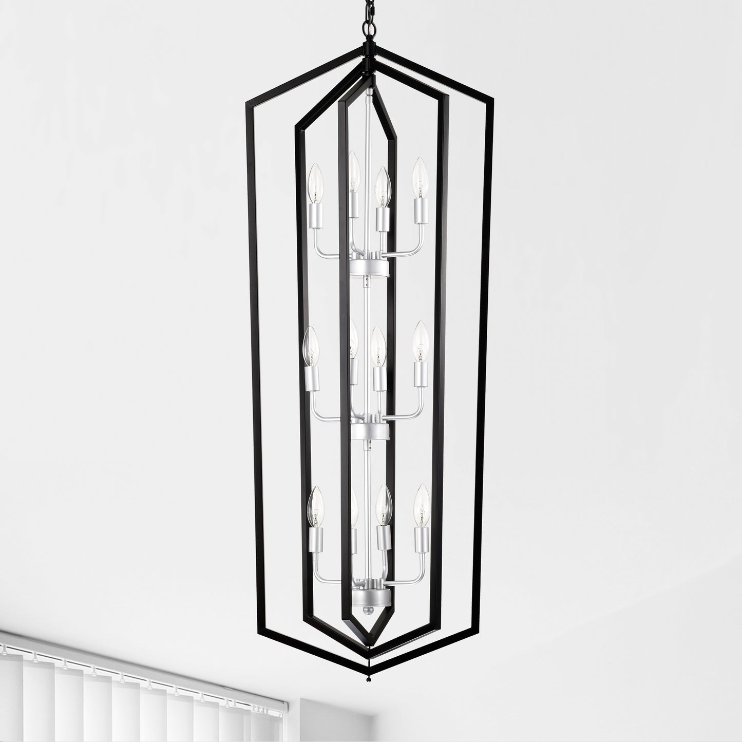Modern black geometric chandelier with silver accents and eight clear candelabra bulbs
