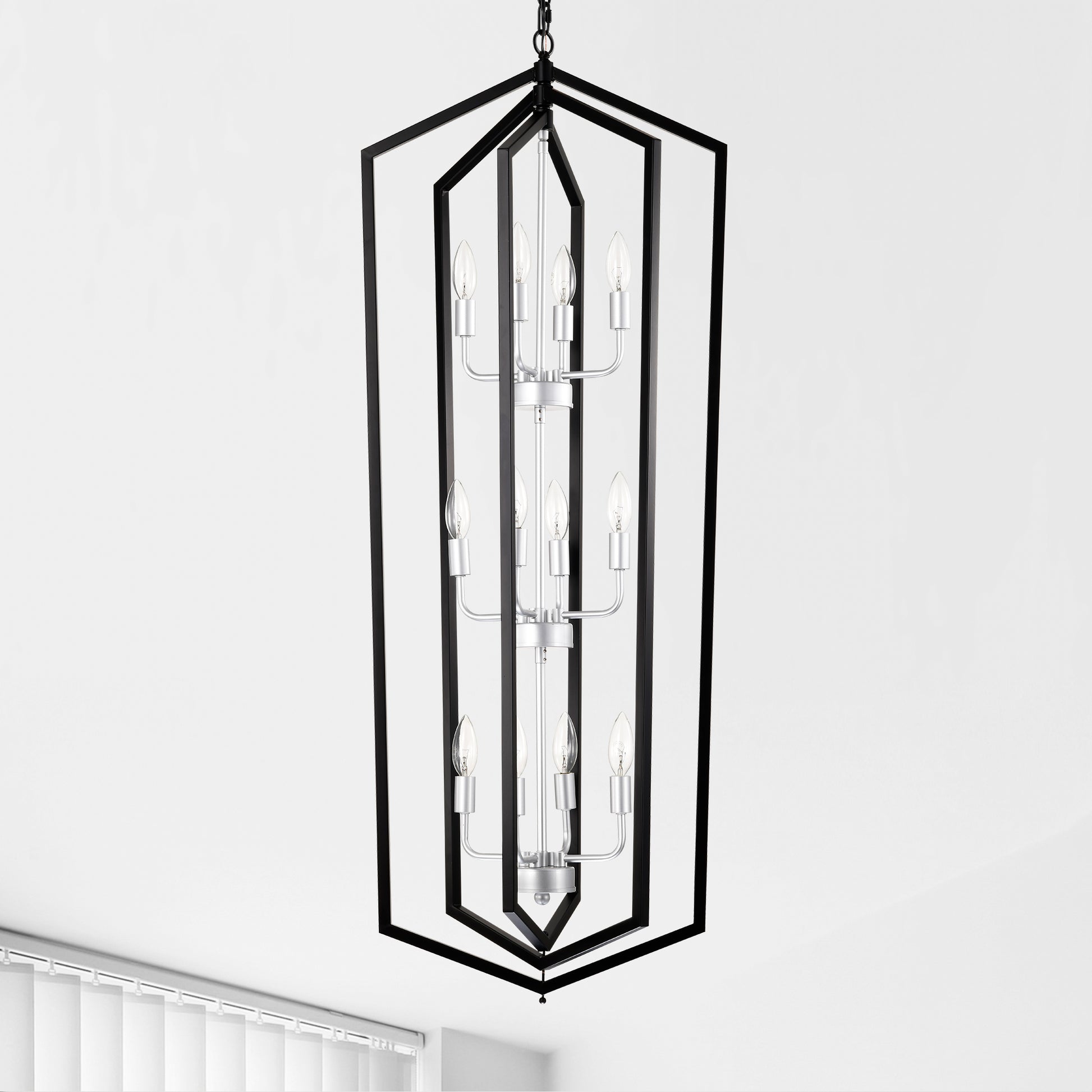 Modern black geometric chandelier with silver accents and eight clear candelabra bulbs