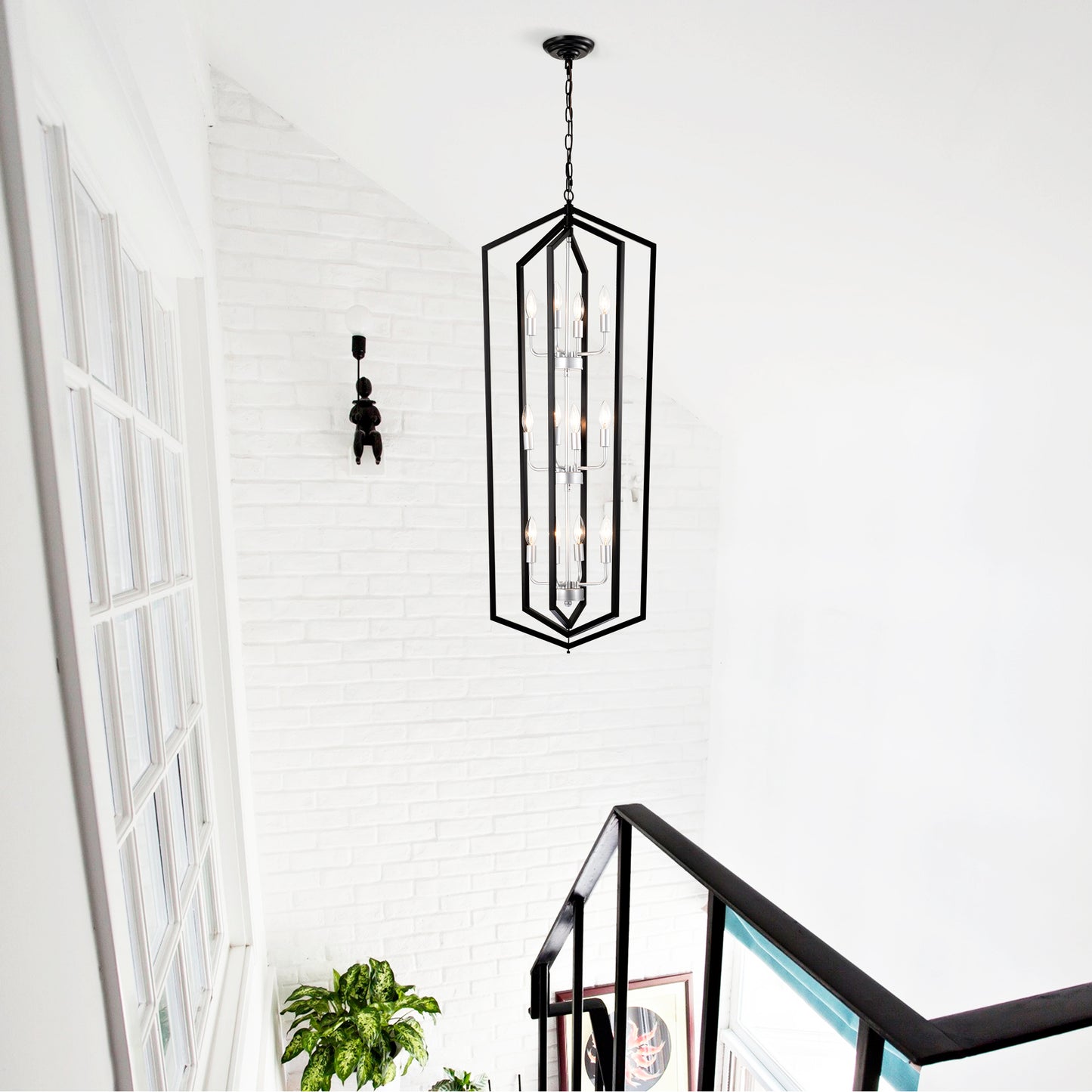 Modern black geometric lantern chandelier with  lights illuminating a stairwell