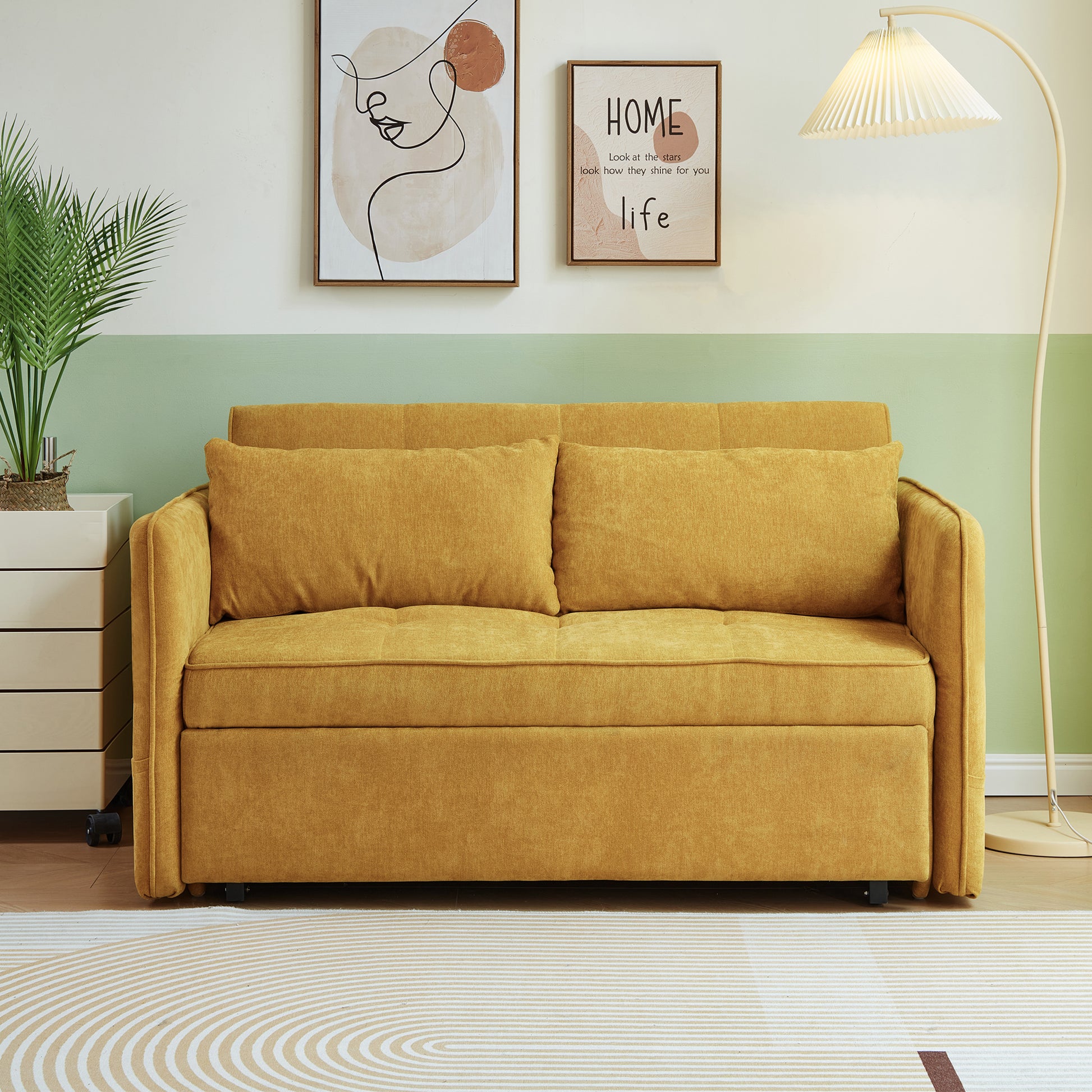 Golden yellow upholstered sofa with tufted seat and two plush cushions