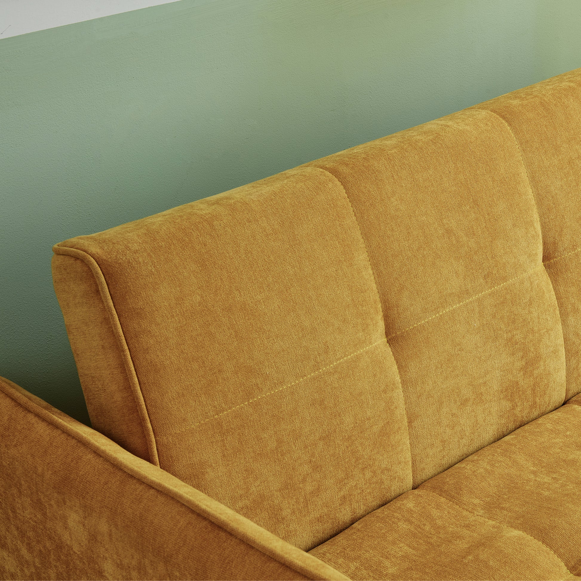 Yellow fabric sofa with tufted back cushions