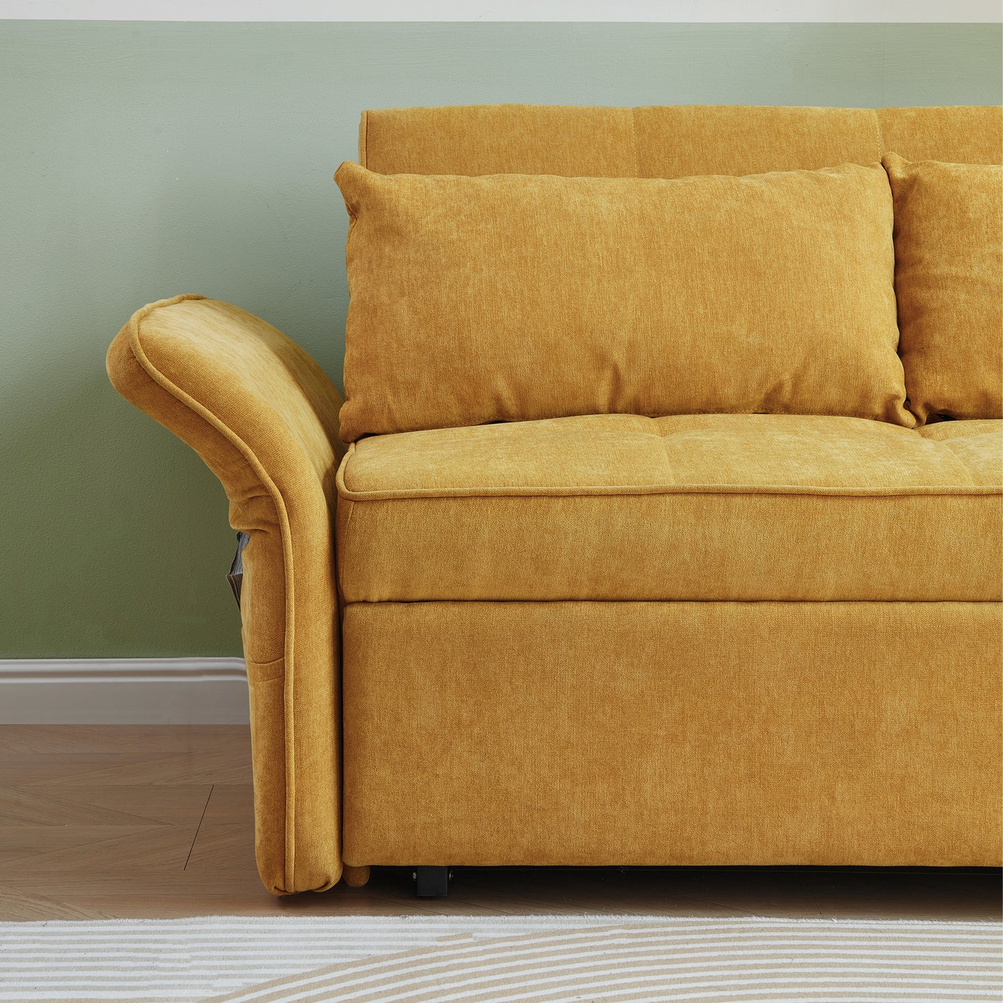 Closeup of a mustard yellow textured fabric sofa with plush cushions and rolled armrest