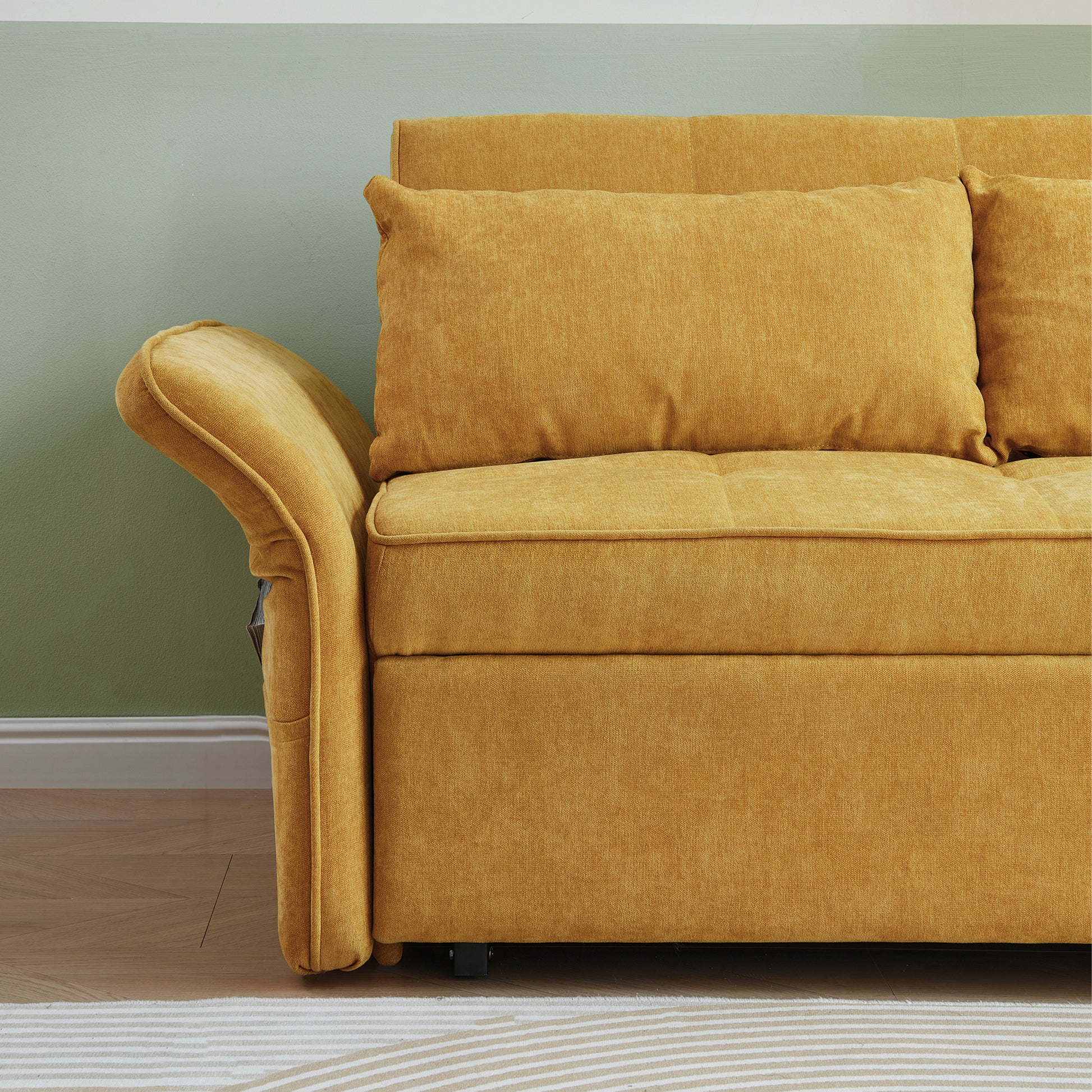 Closeup of a mustard yellow textured fabric sofa with plush cushions and rolled armrest