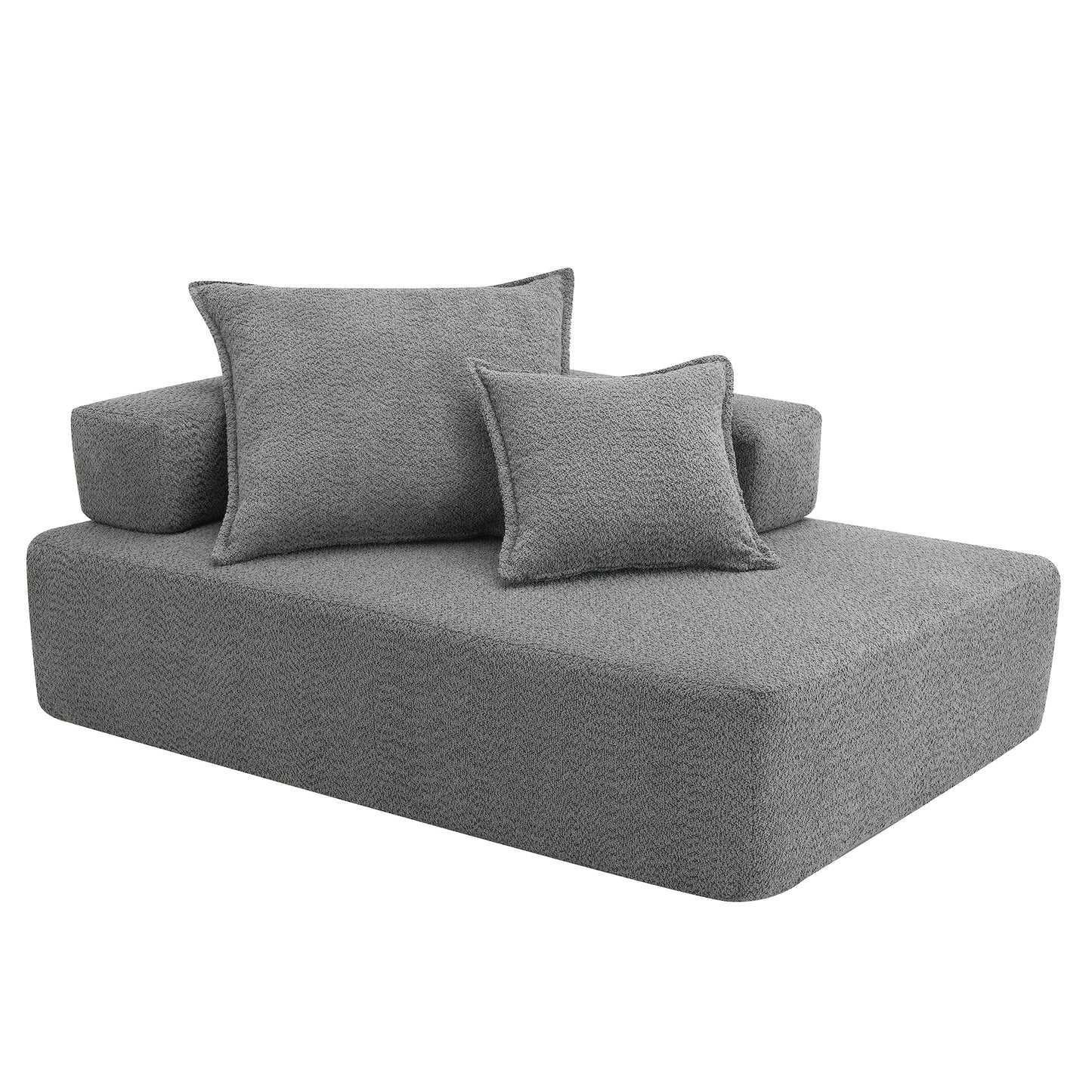Modern grey fabric chaise lounge with two accent pillows perfect for relaxation