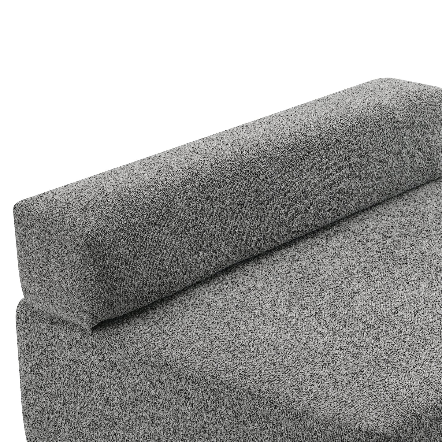 Closeup of a textured grey fabric sofa cushion with a rounded bolster