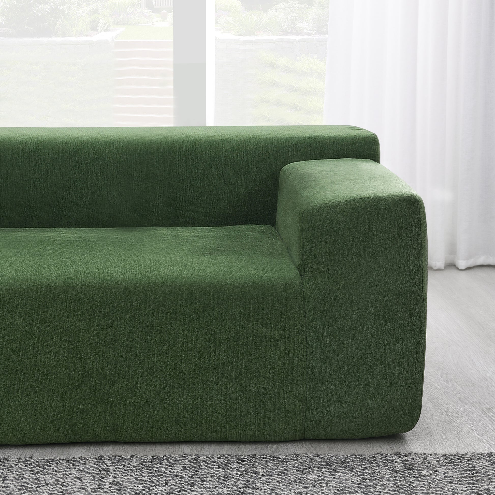 Deep green textured fabric sofa armrest and seat minimalist design for modern living room