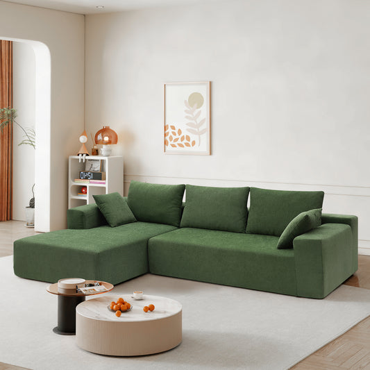 Deep green sectional sofa with plush cushions perfect for modern living rooms