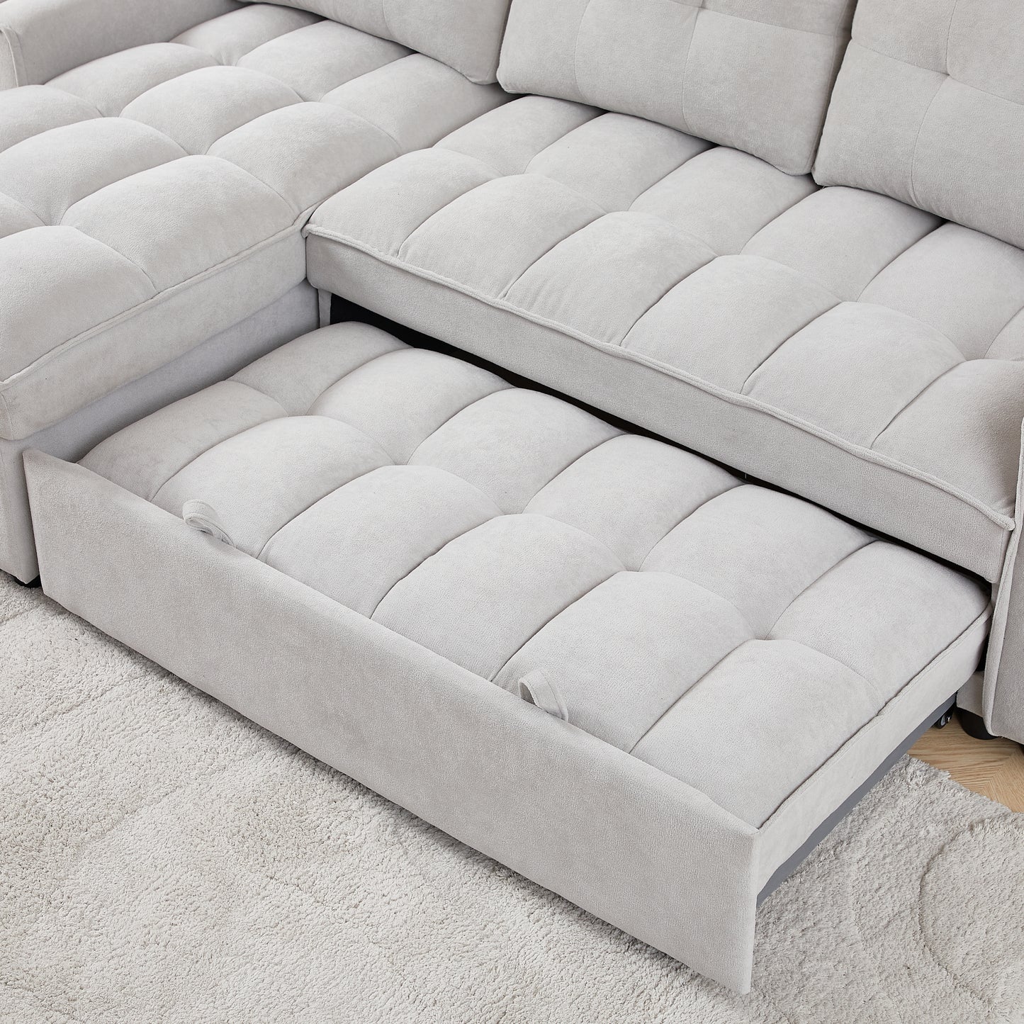 Light gray sectional sofa with pullout bed feature