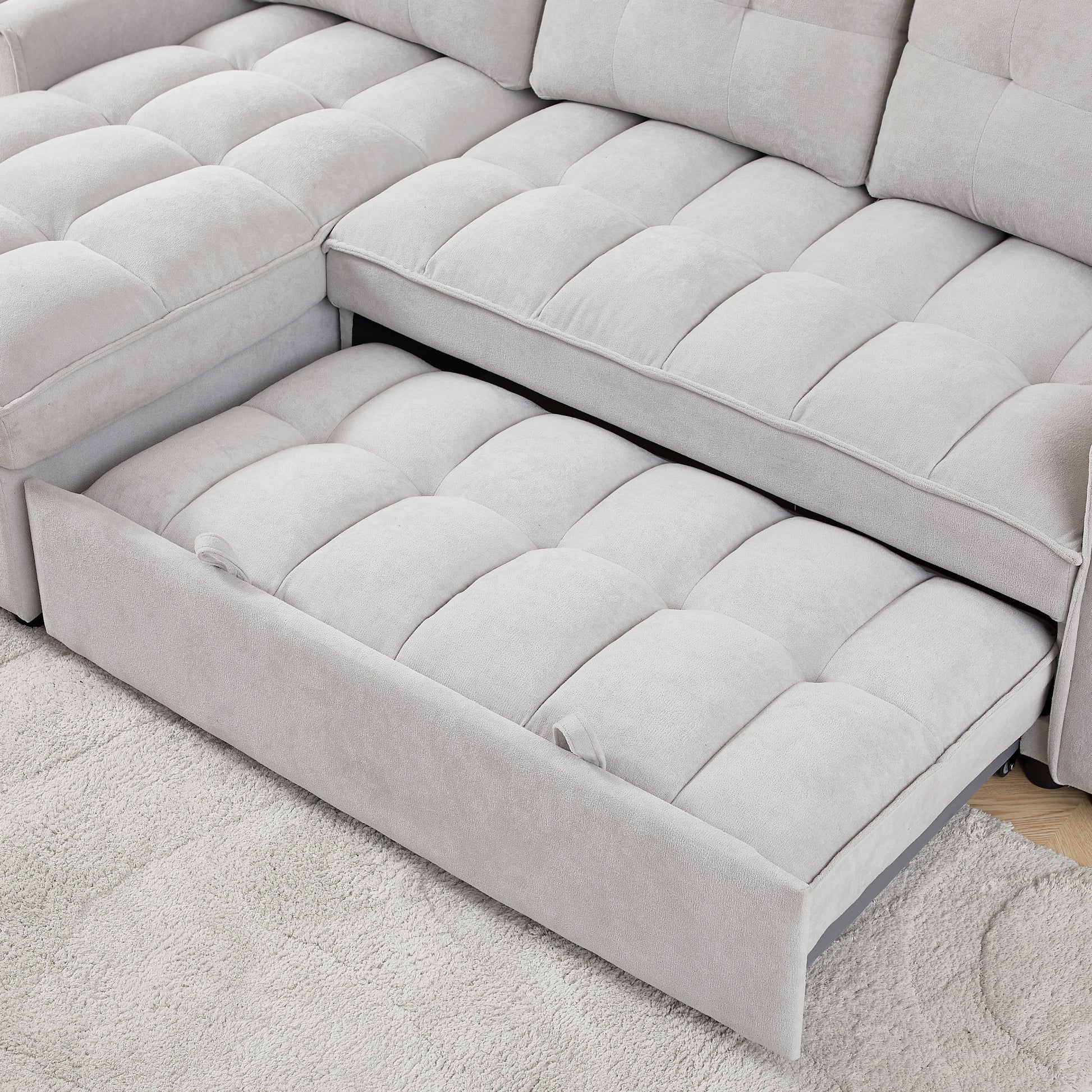 Light gray sectional sofa with pullout bed feature