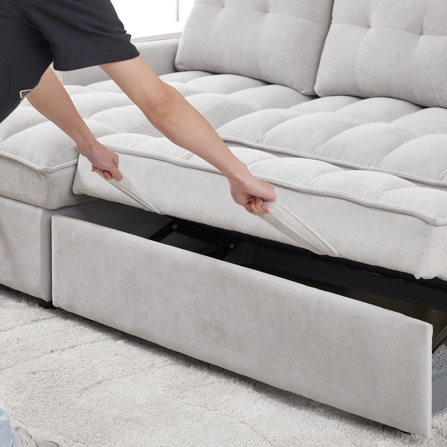 Light grey sectional sofa with pullout storage drawer open