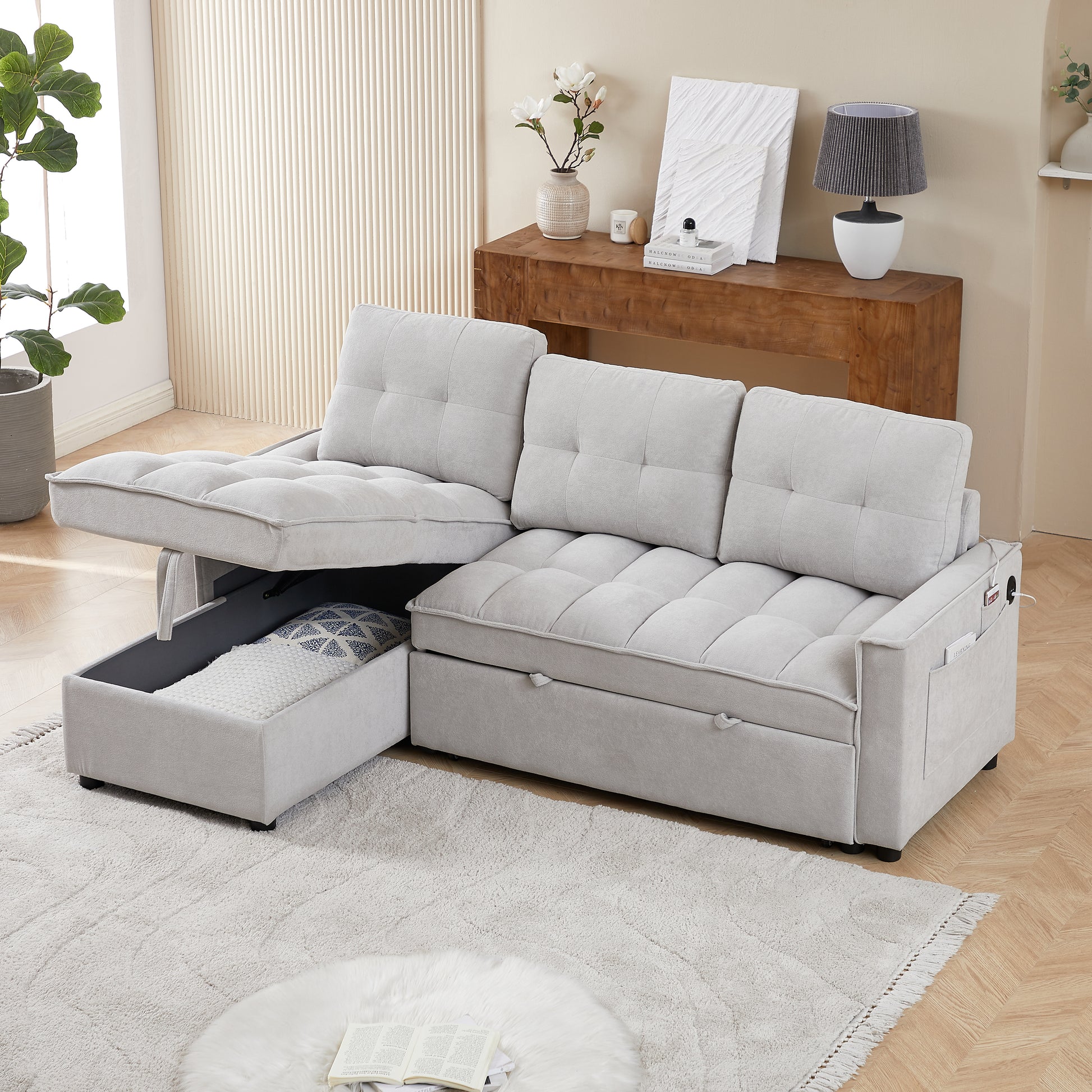 Light gray sectional sofa with tufted cushions and hidden storage compartment shown in a modern living room