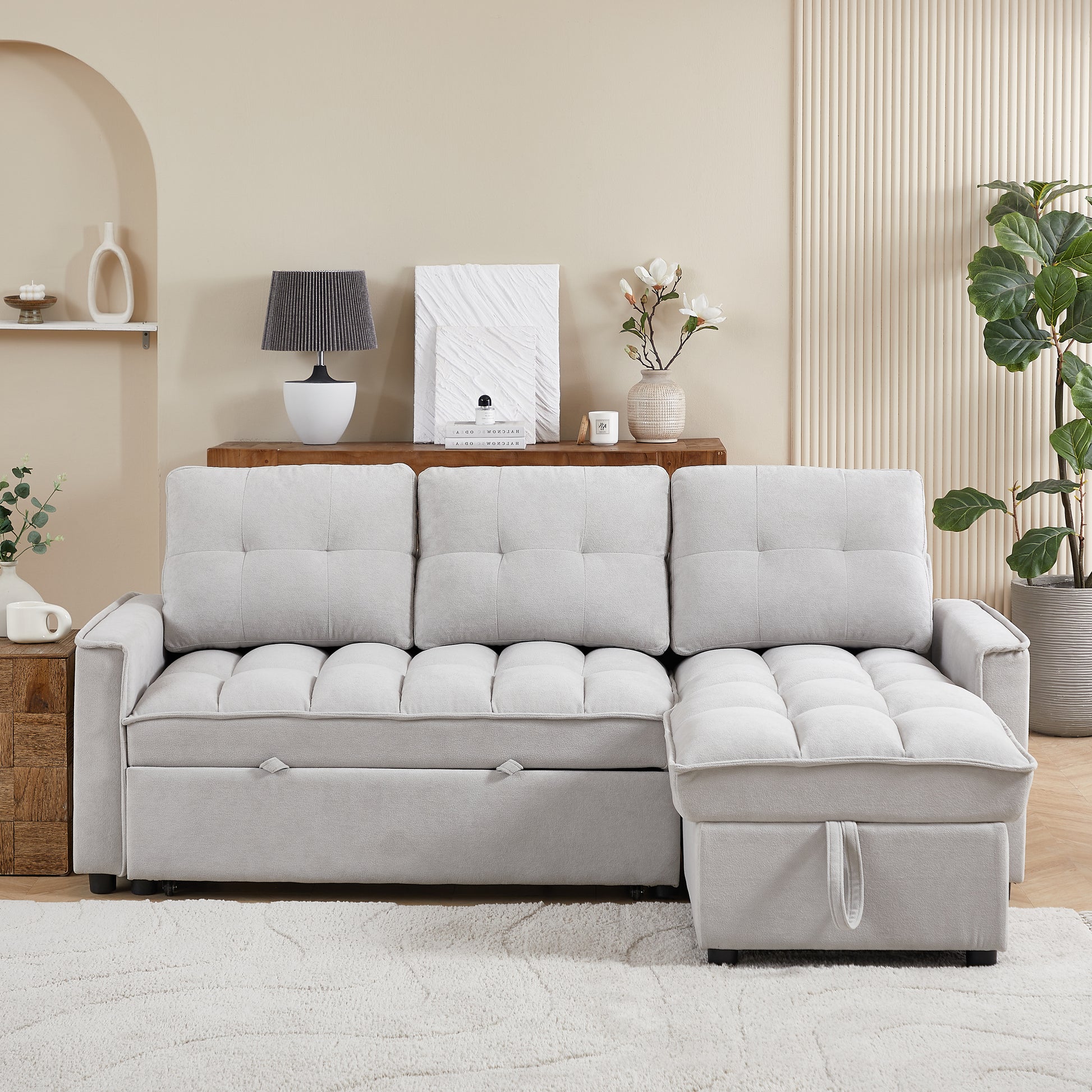 Light gray tufted sectional sofa with storage chaise ideal for modern living rooms