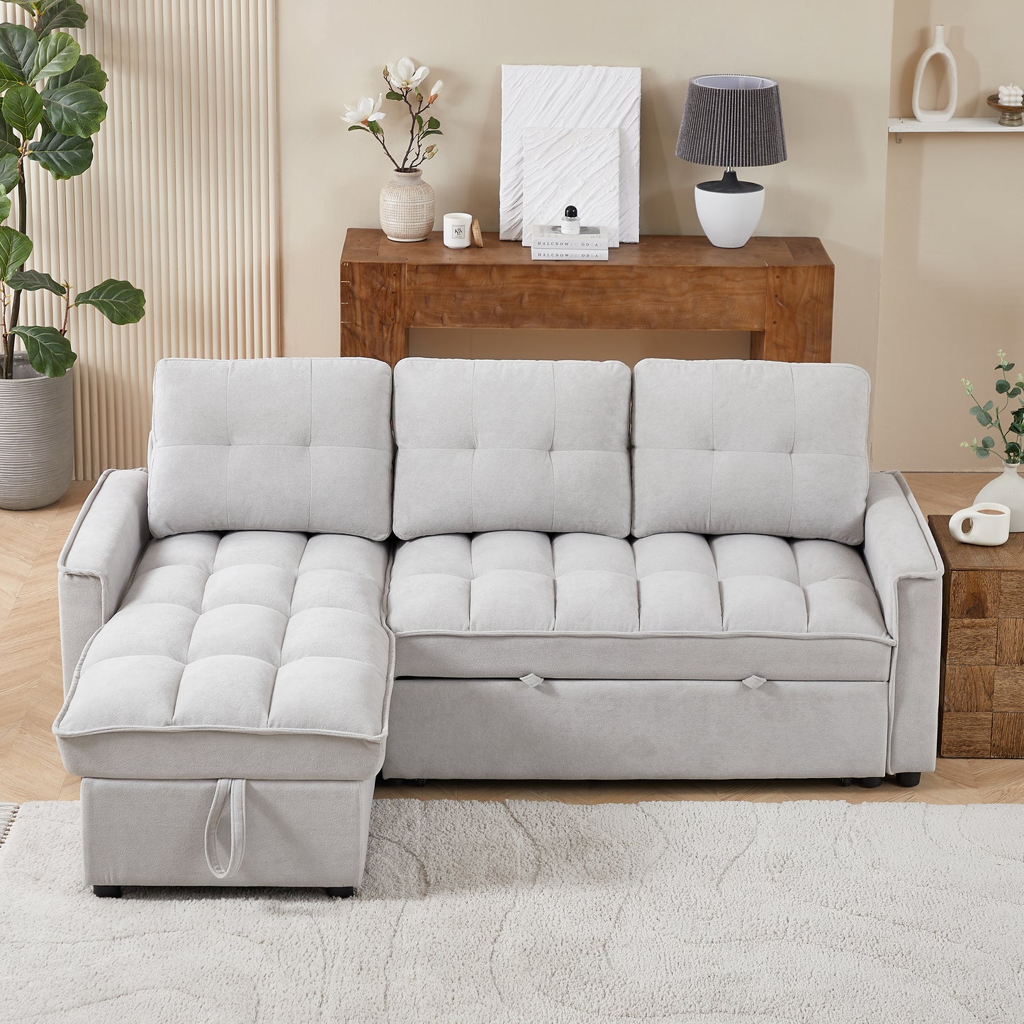 Light grey tufted sectional sofa with chaise offering modern living room seating