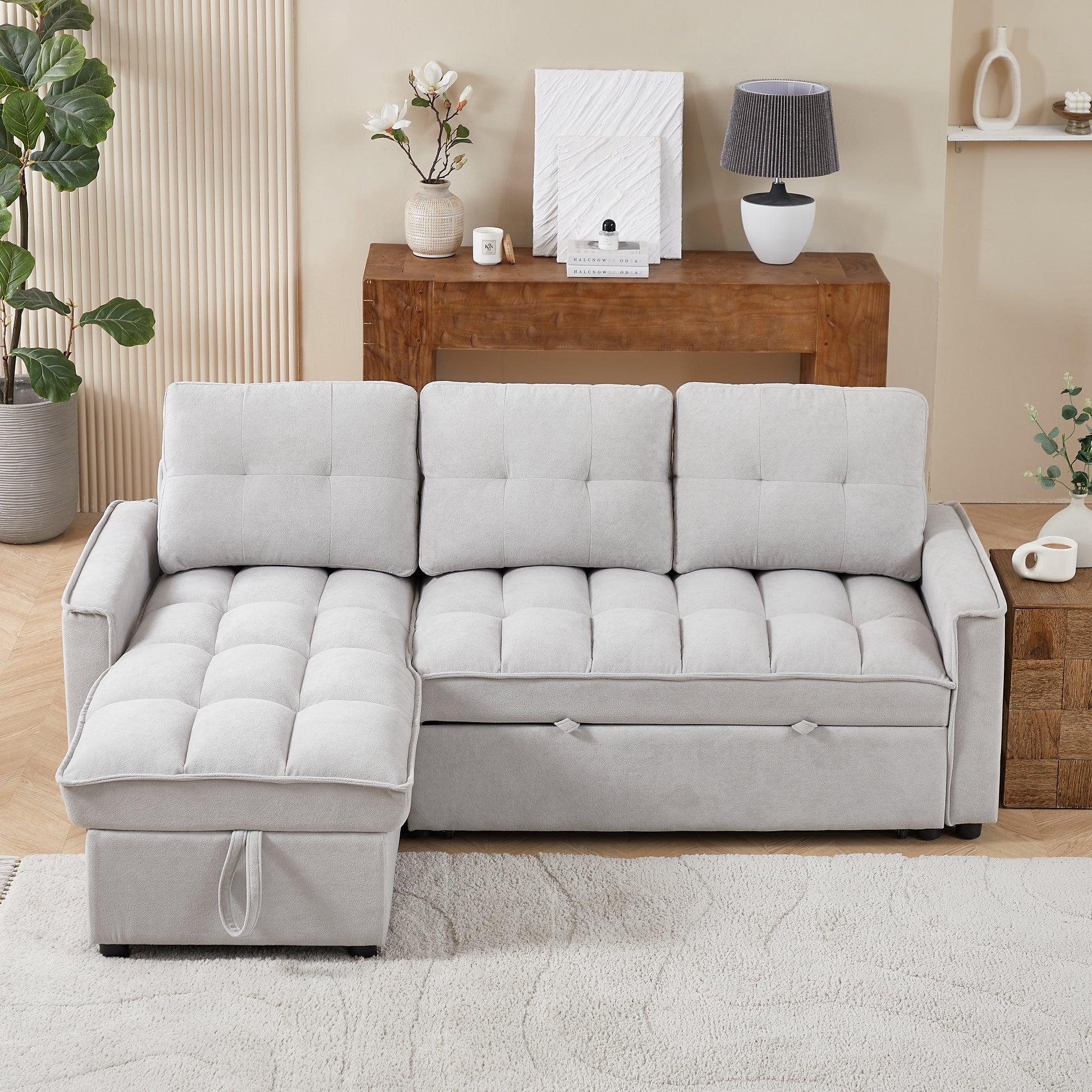 Light grey tufted sectional sofa with chaise offering modern living room seating