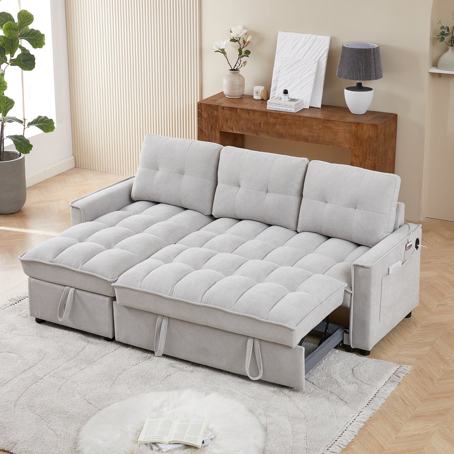 Light gray fabric sectional sofa with pullout bed feature