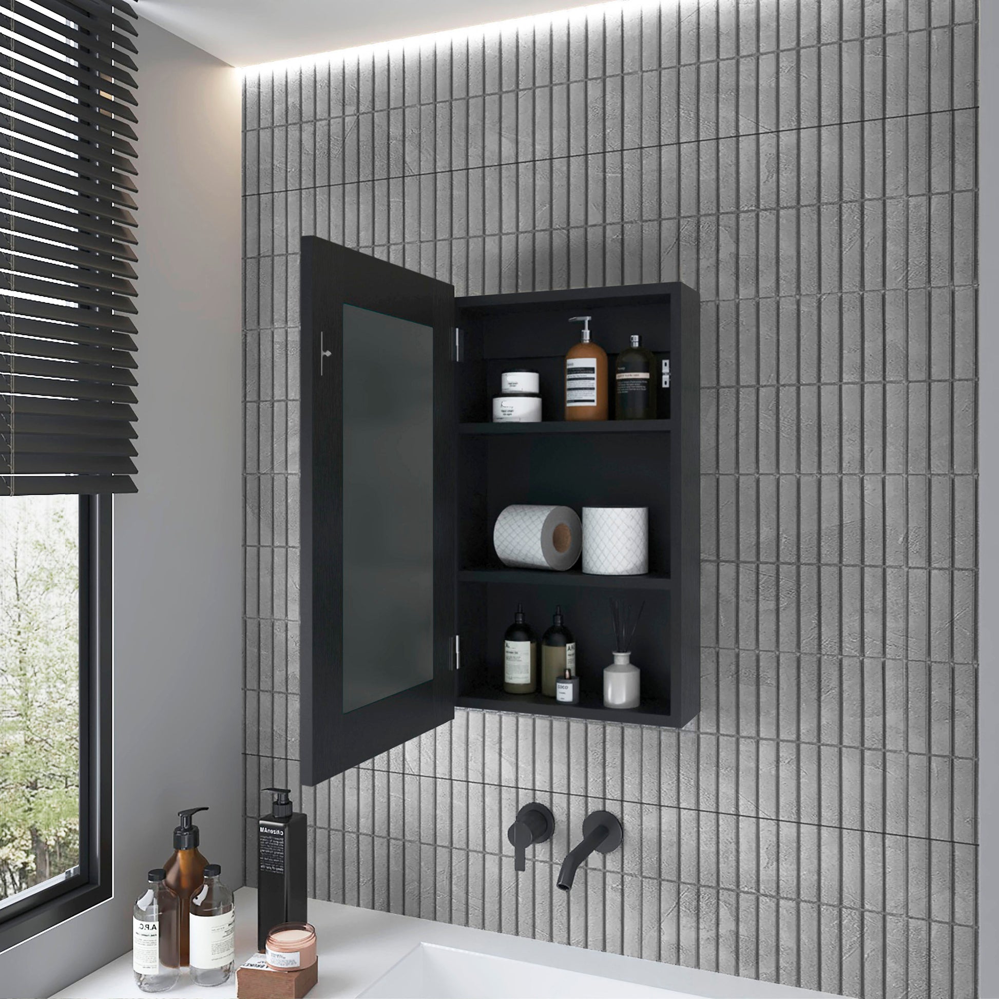 Dark modern medicine cabinet with open door revealing toiletries and toilet paper rolls