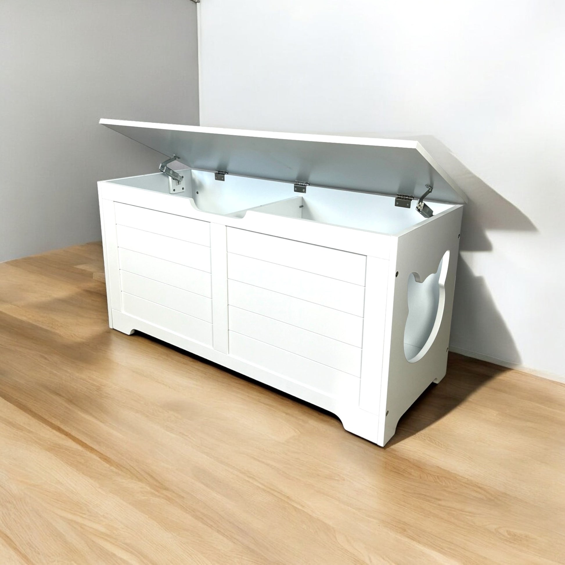 White wooden toy chest with hinged lid and cute catshaped side cutouts for storage
