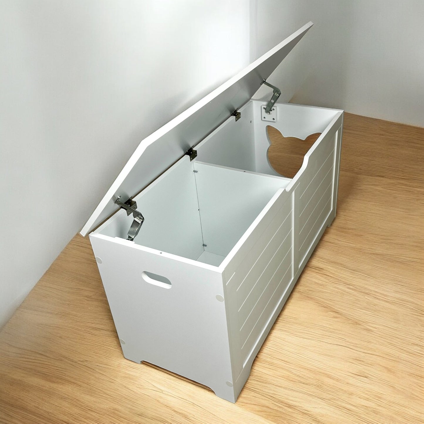 Open white wooden litter box enclosure with a cat face cutout