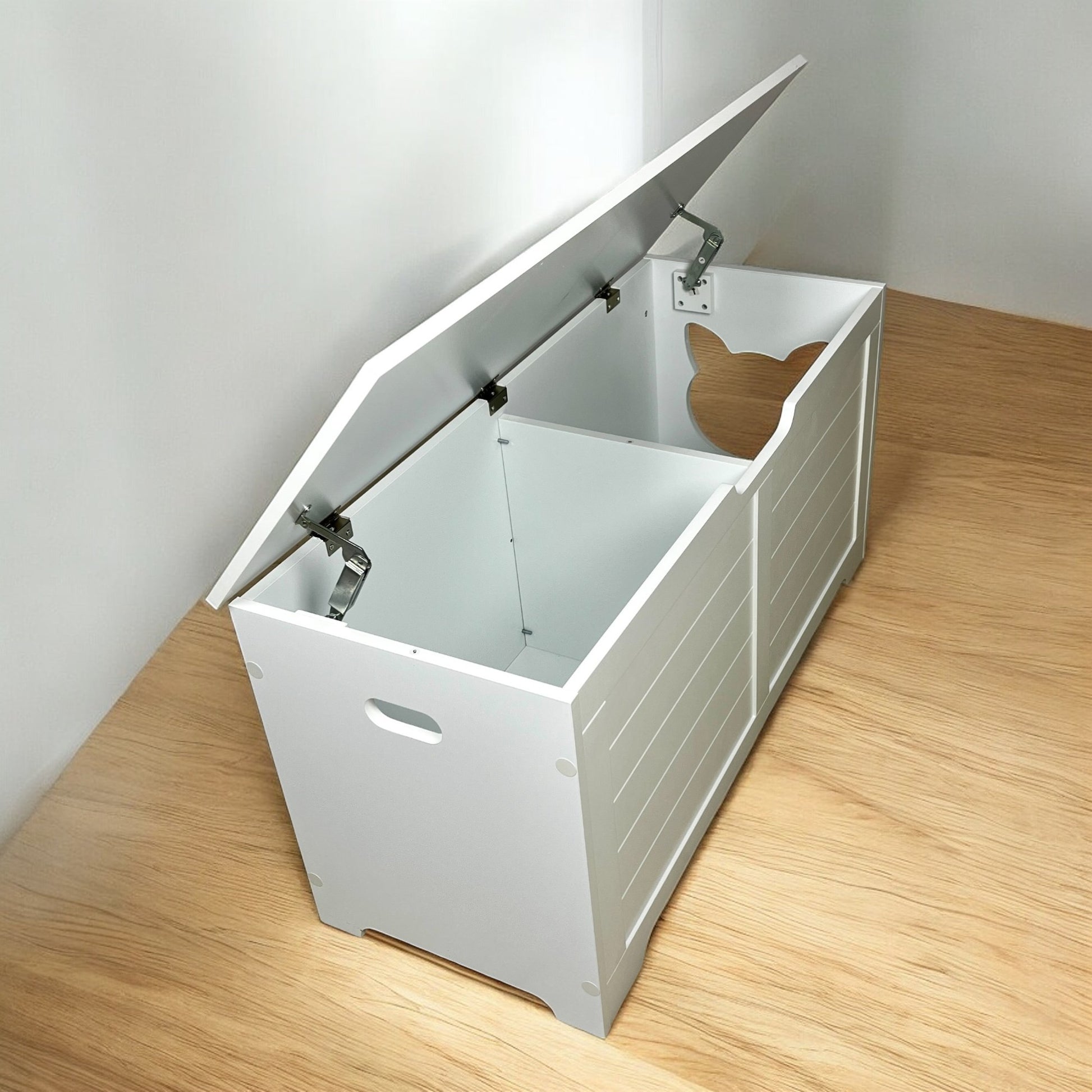 Open white wooden litter box enclosure with a cat face cutout