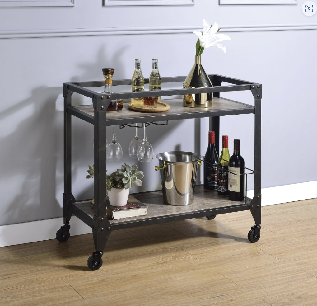 Industrial style metal and wood bar cart with wine bottles and glasses