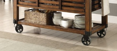 Rustic wooden kitchen island cart with basket and dishes