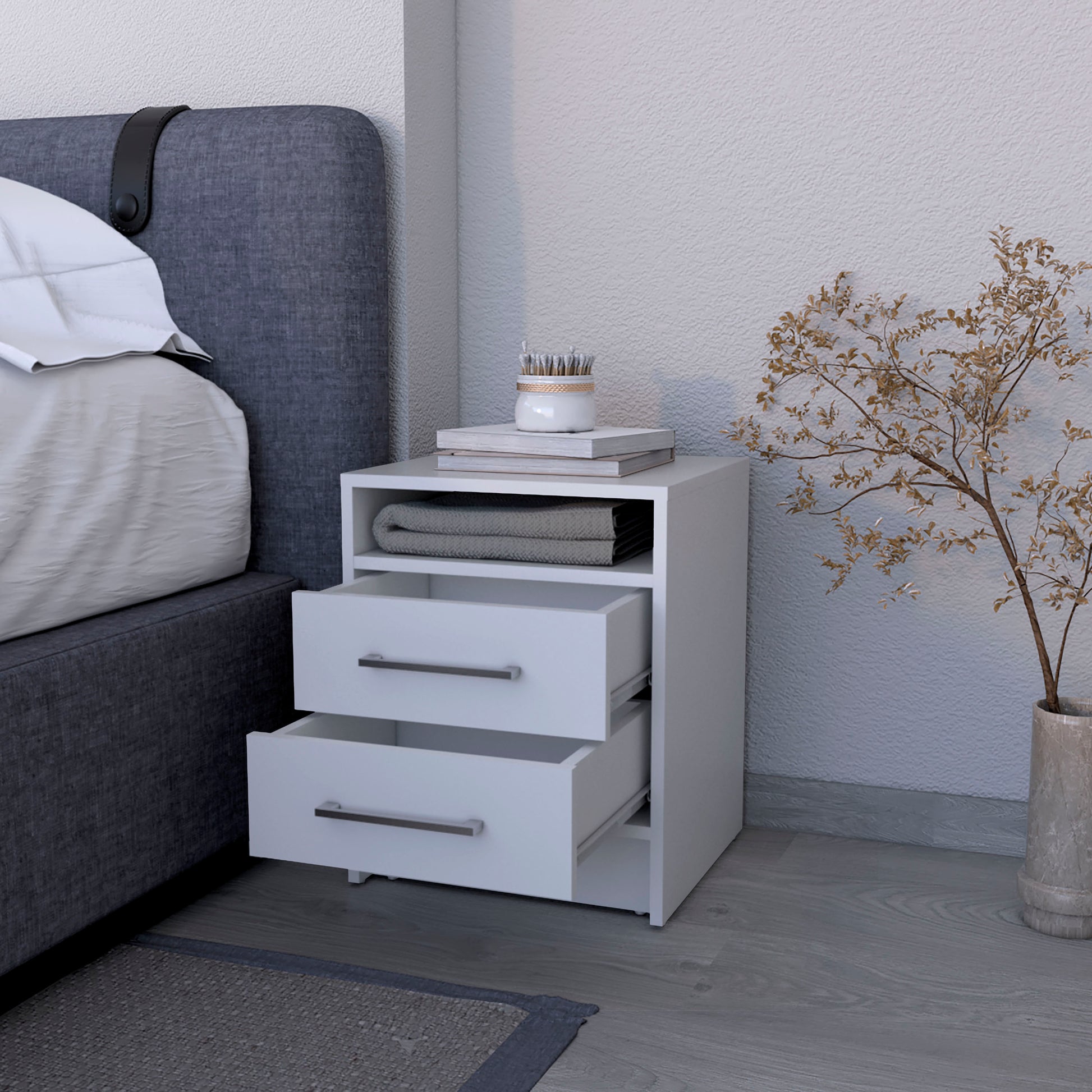 Modern white bedside table with two drawers and an open shelf