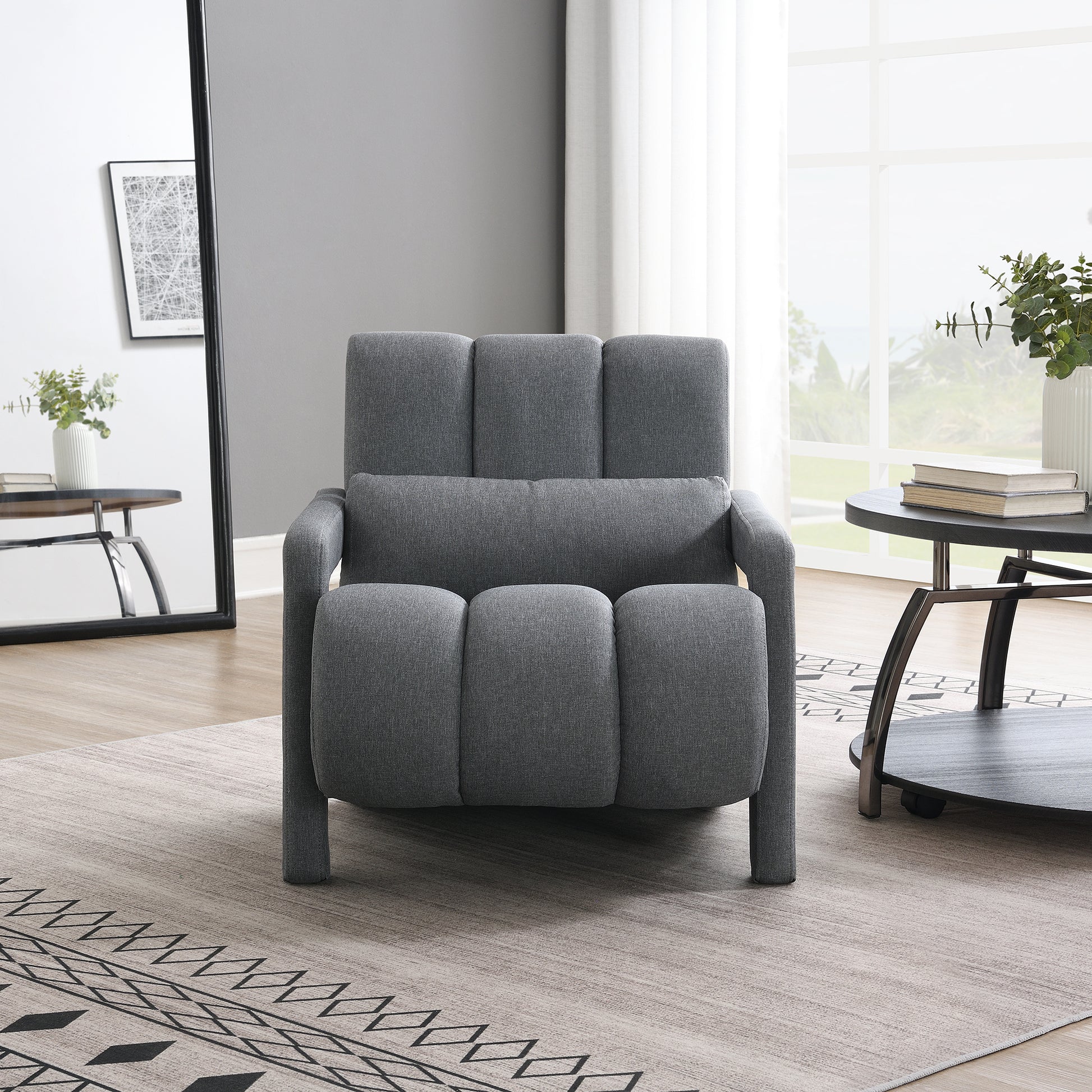 Grey upholstered accent chair with padded seat and back cushions