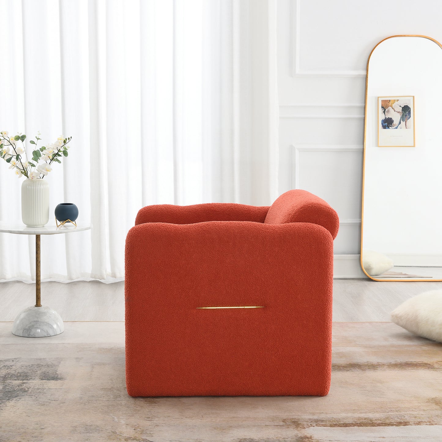 Orange boucle accent chair with gold handle detail
