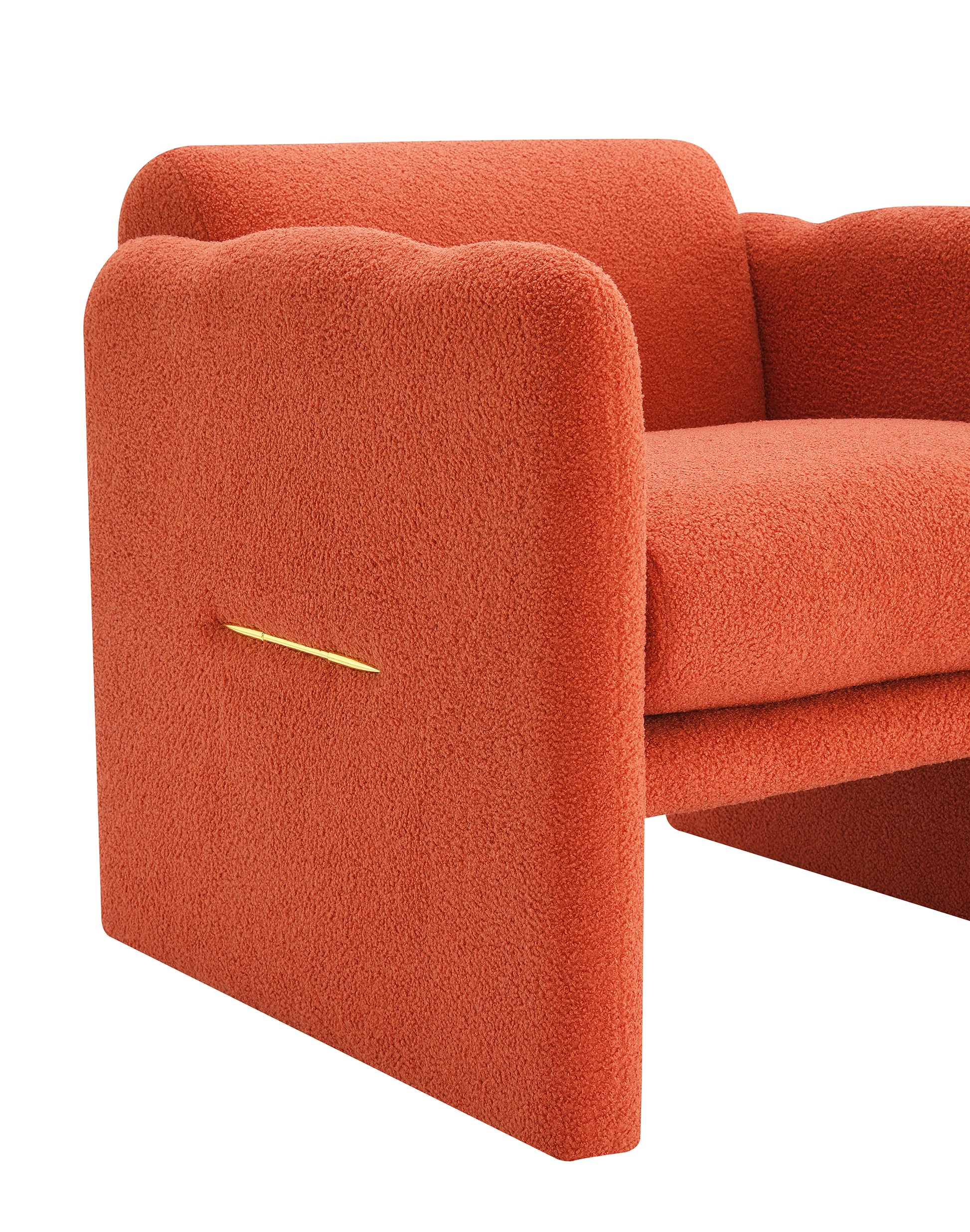 Orange boucle armchair with rounded arms and a gold accent detail
