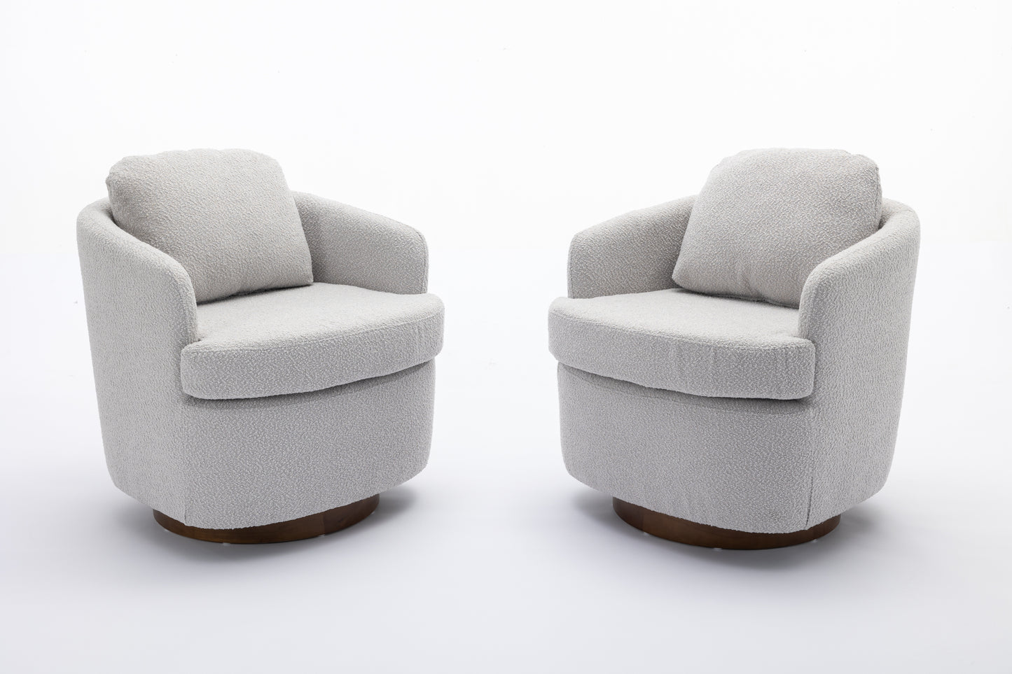 Pair of modern grey boucl swivel accent chairs with rounded bases and plush cushions