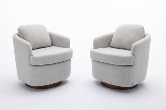 Pair of modern grey boucl swivel accent chairs with rounded bases and plush cushions