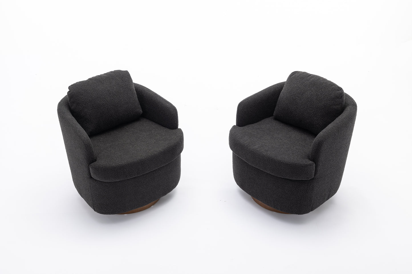 Two dark charcoal fabric accent chairs with plush seat cushions and wooden bases