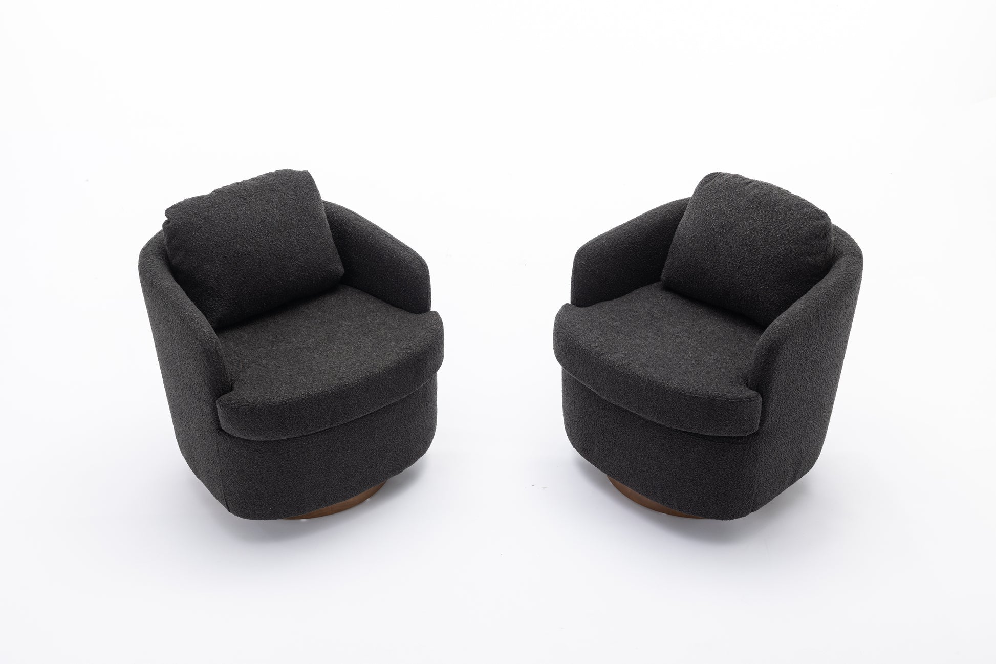 Two dark charcoal fabric accent chairs with plush seat cushions and wooden bases