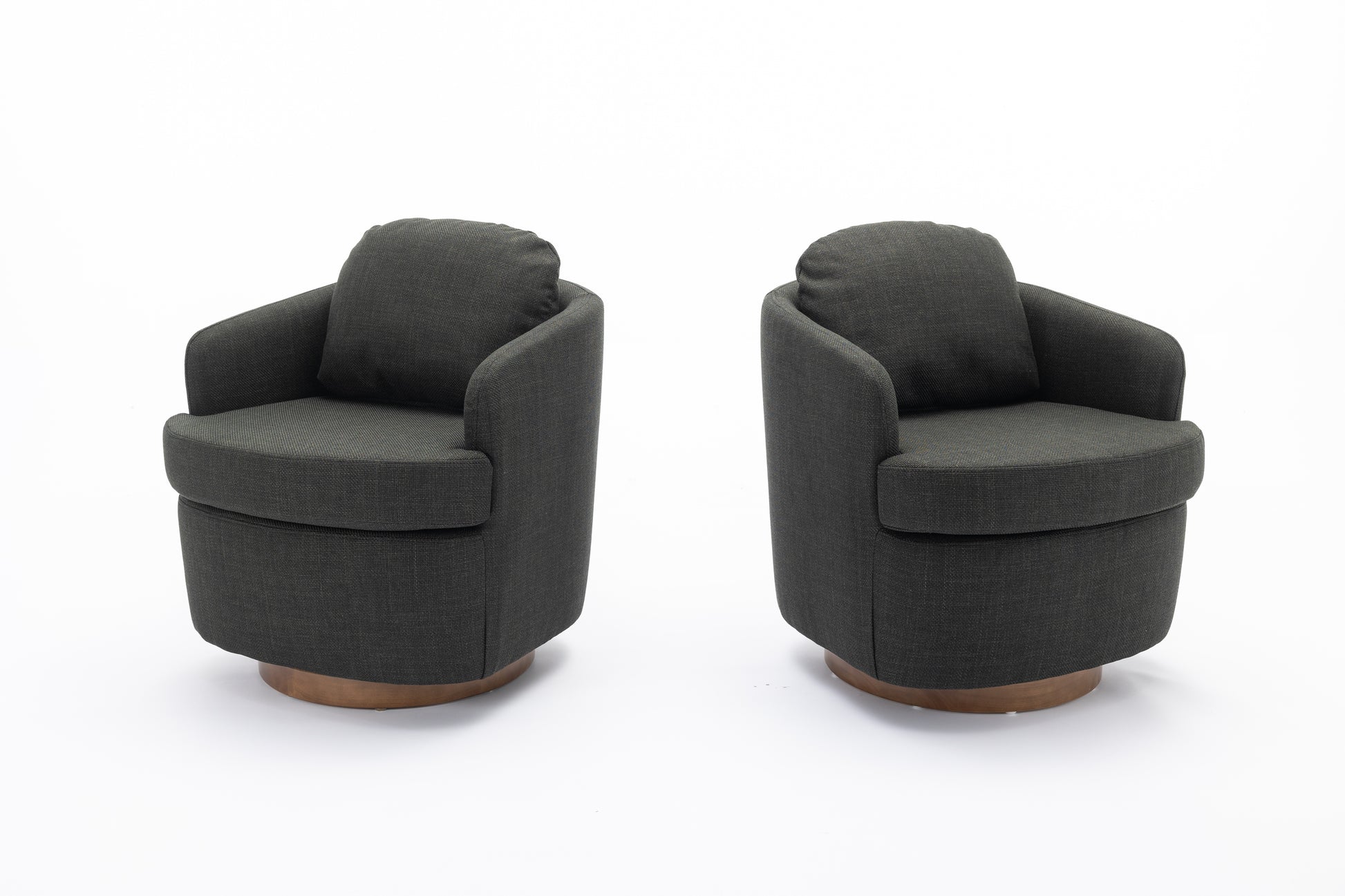 Two dark grey fabric swivel accent chairs with wood bases on a white background