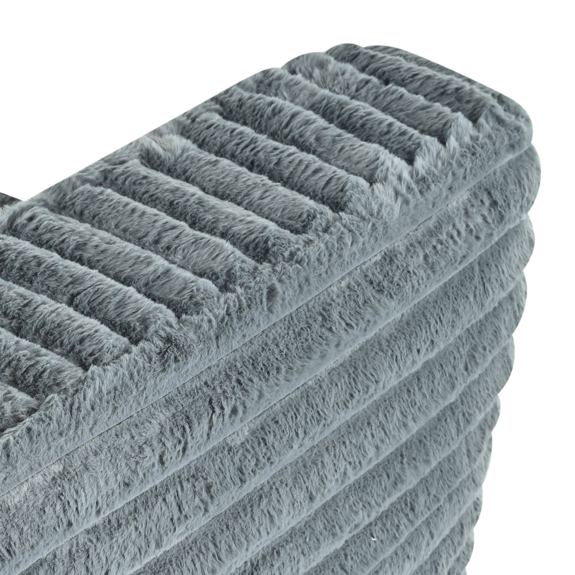 Soft grey plush throw blanket with ribbed texture for cozy home decor