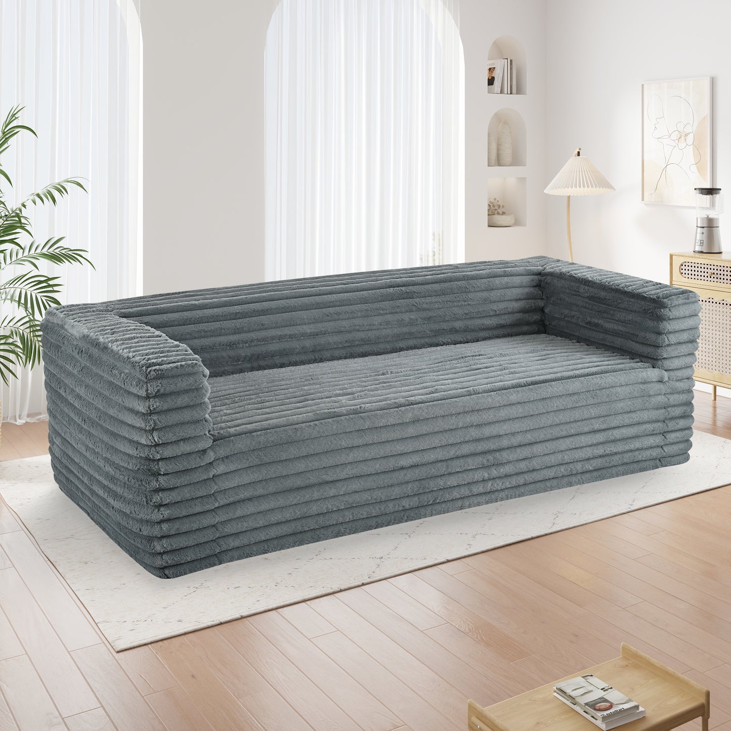 Grey corduroy sofa with plush textured upholstery for a cozy living room