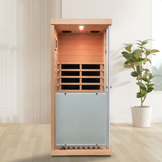 Modern infrared sauna with natural wood finish and glass door for home wellness