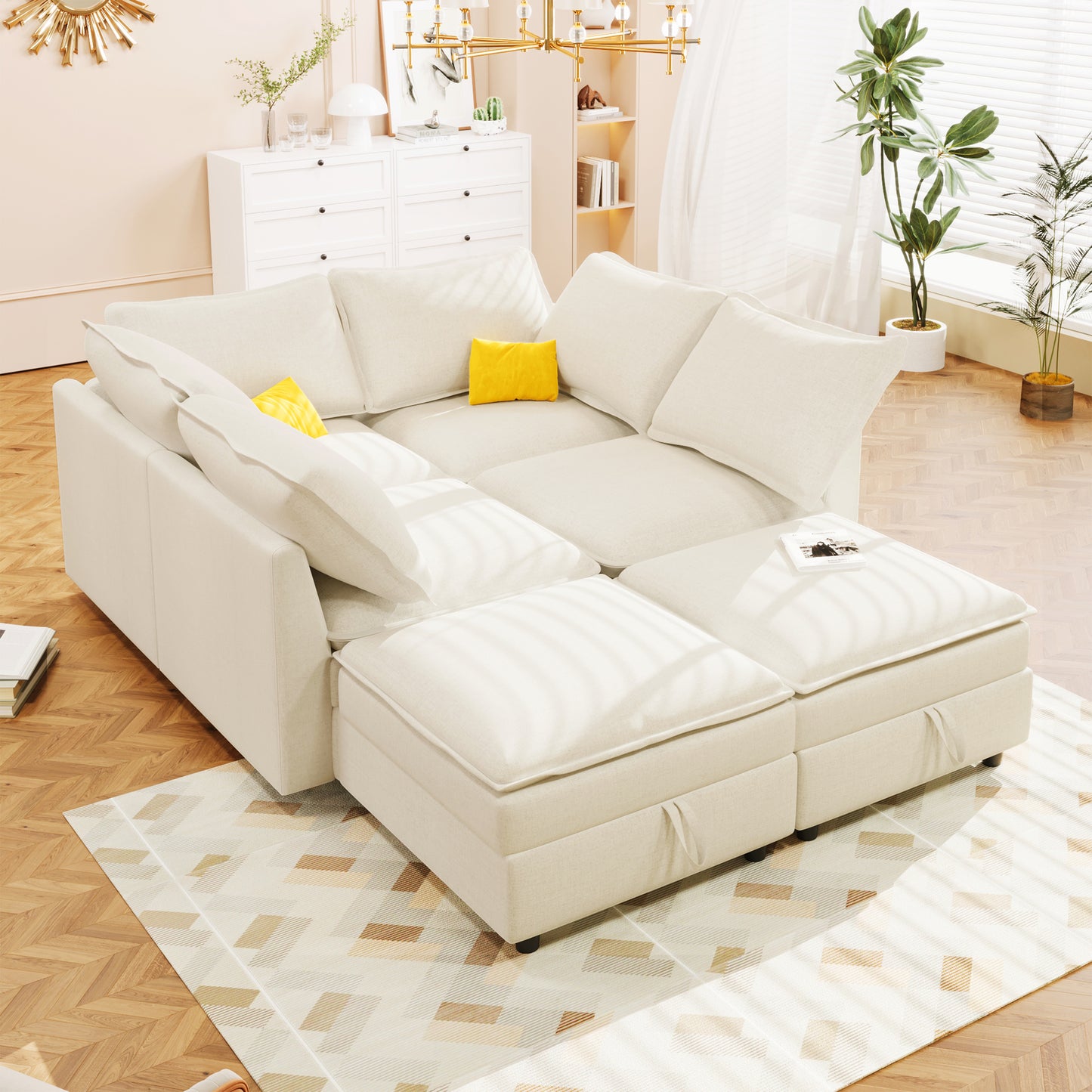 Cream fabric sectional sofa with modular ottomans and a yellow accent pillow