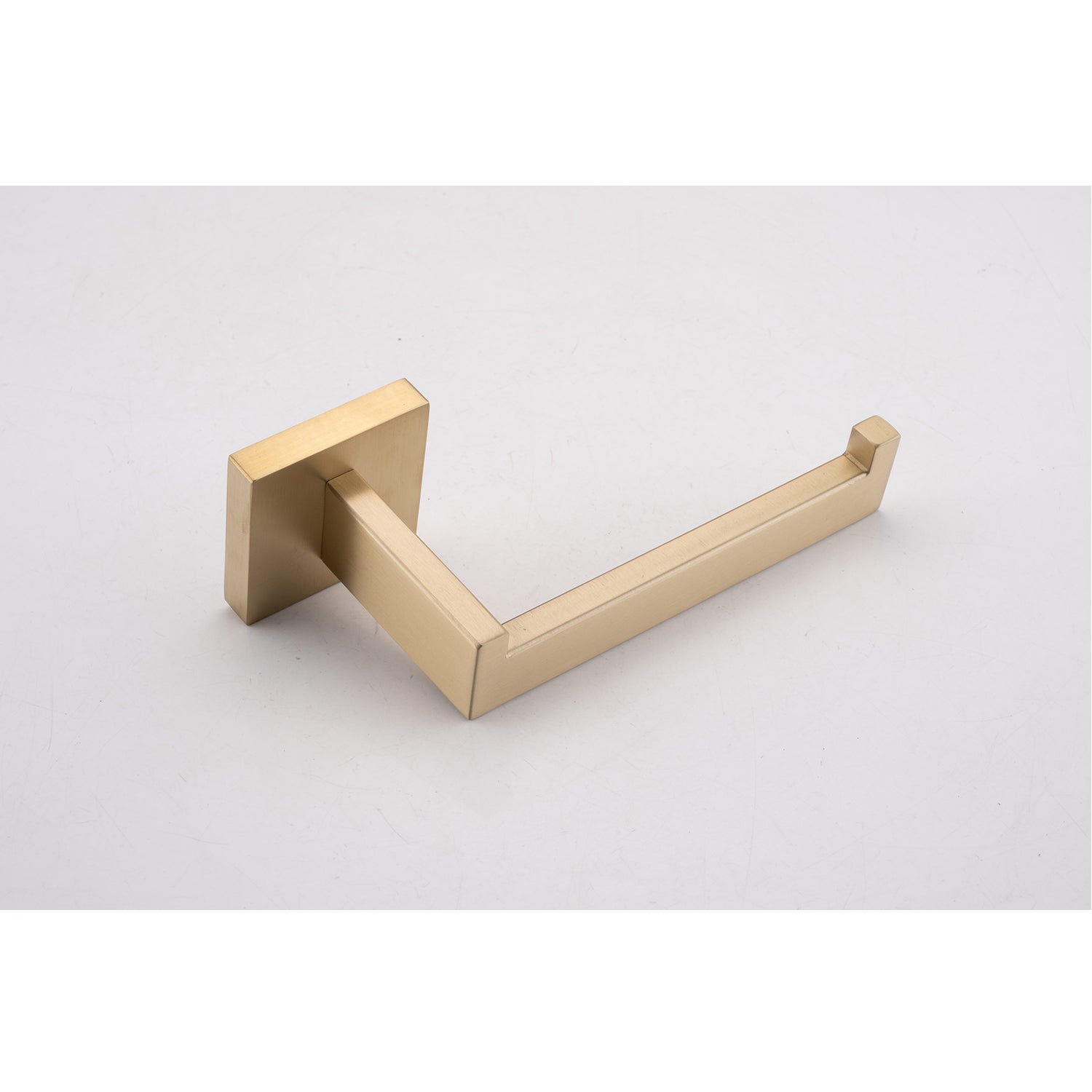Brushed brass toilet paper holder with a modern square base and sleek arm