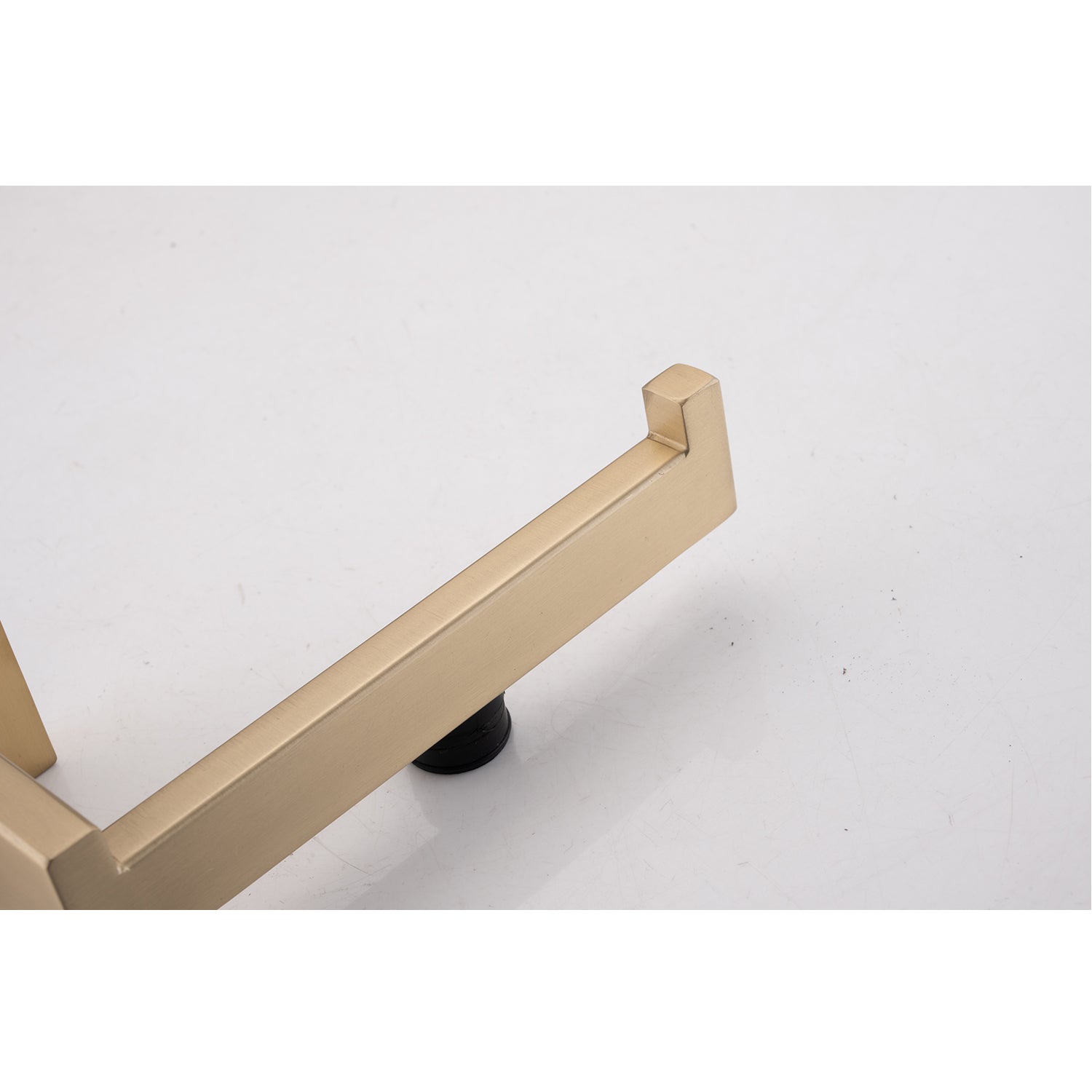 Brushed gold toilet paper holder with minimalist design