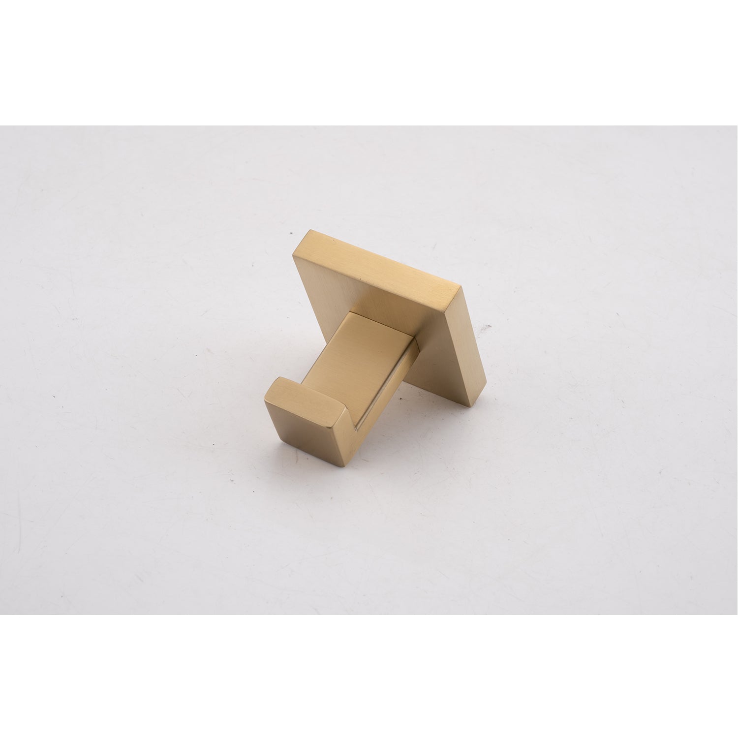 Brushed brass modern square robe hook mounted on a white background
