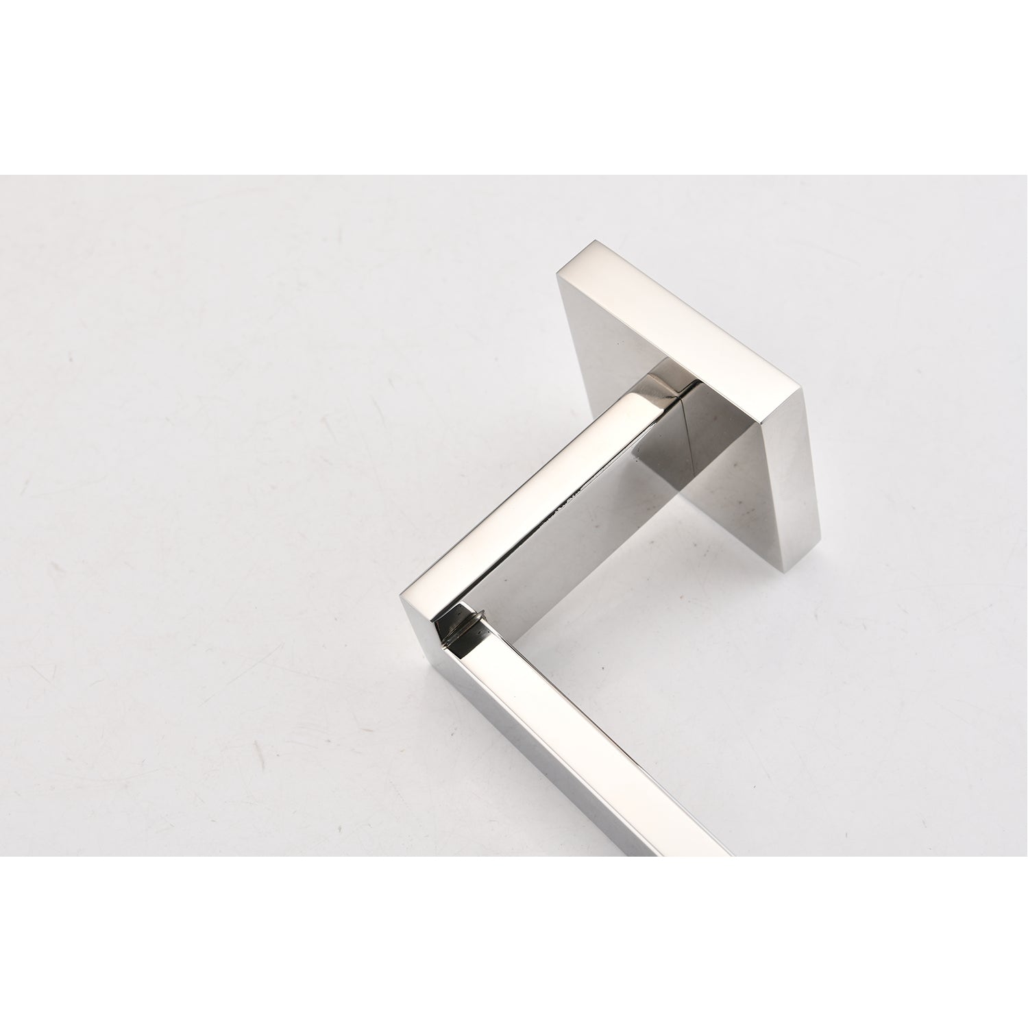 Polished chrome toilet paper holder with a modern square design